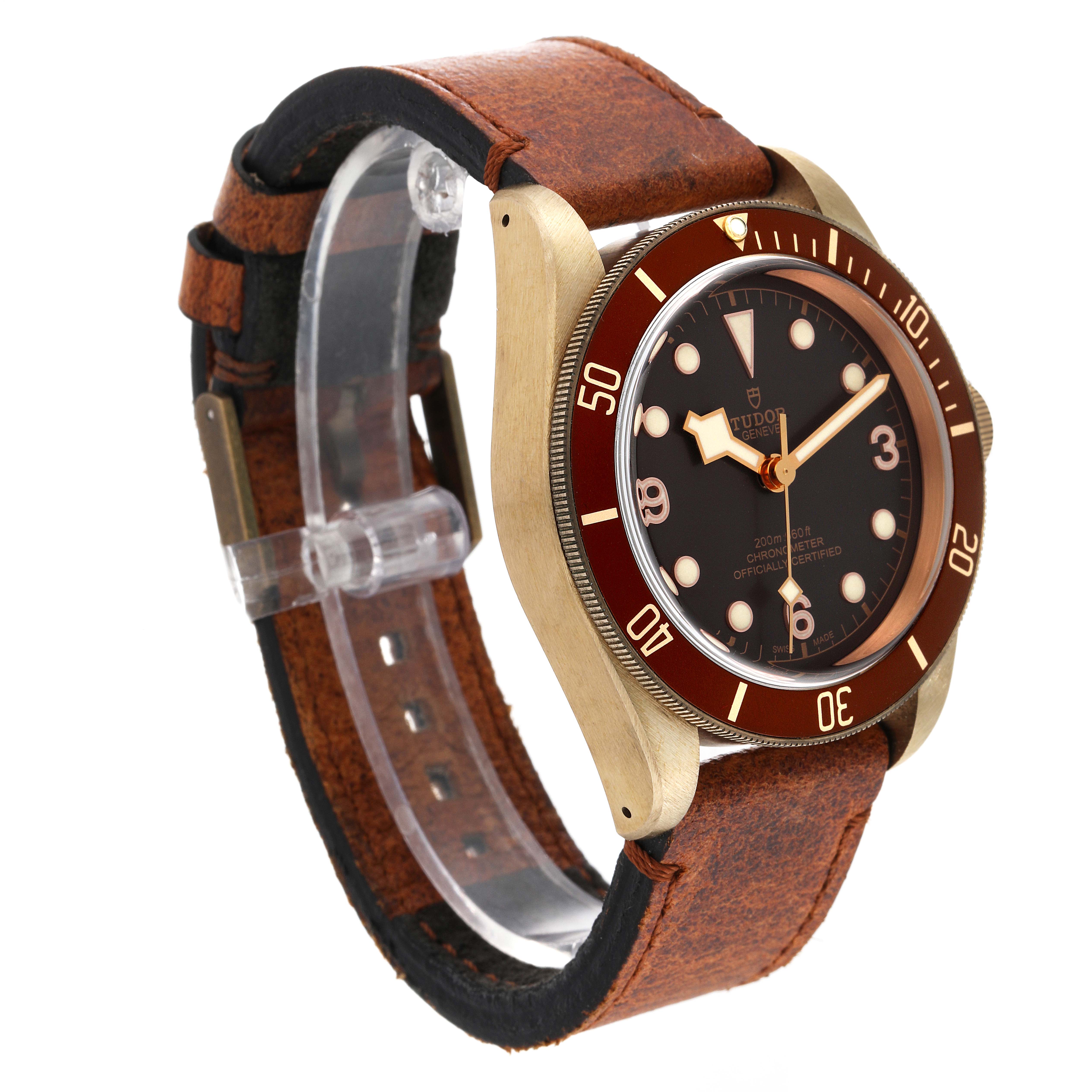 The Tudor Heritage Black Bay 79250B Men's Bronze Brown Dial 79250B Men's Bronze Brown Dial watch is shown at an angle displaying the face, bezel, and leather strap.
