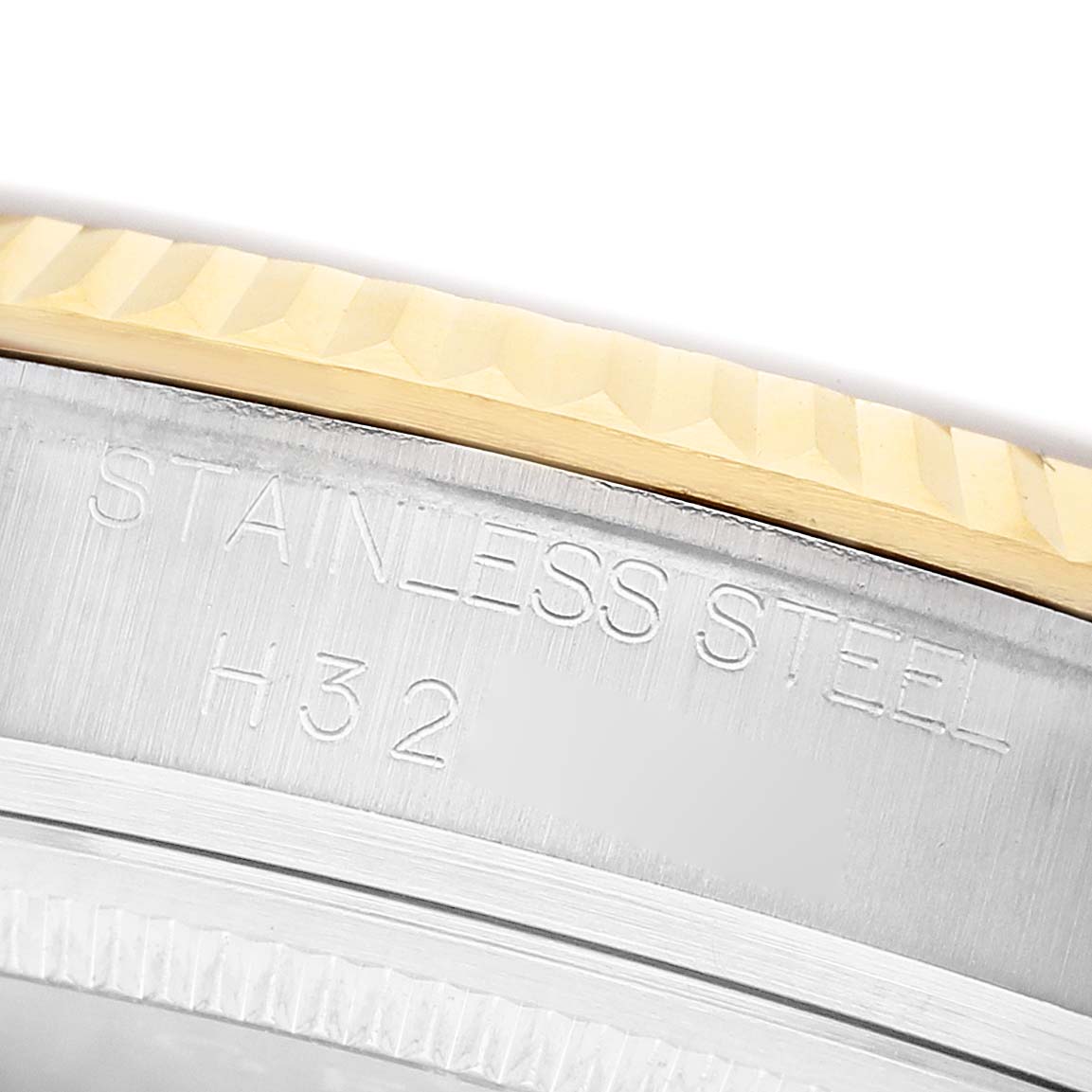 The image shows a close-up side view of a Tudor Prince 72033 Men's Steel and Gold (two tone) Blue Dial watch bezel and case edge, highlighting its "STAINLESS STEEL" engraving.