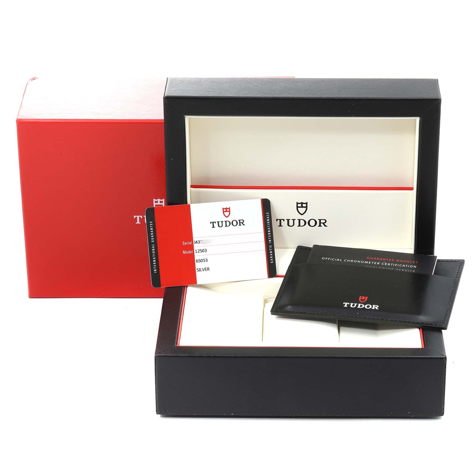 This image shows the packaging and accessories for the Tudor Style M12713-0003 Men's Steel and Gold (two tone) Silver Dial M12713-0003 Men's Steel and Gold (two tone) Silver Dial model watch, including the warranty card, booklet, and box.