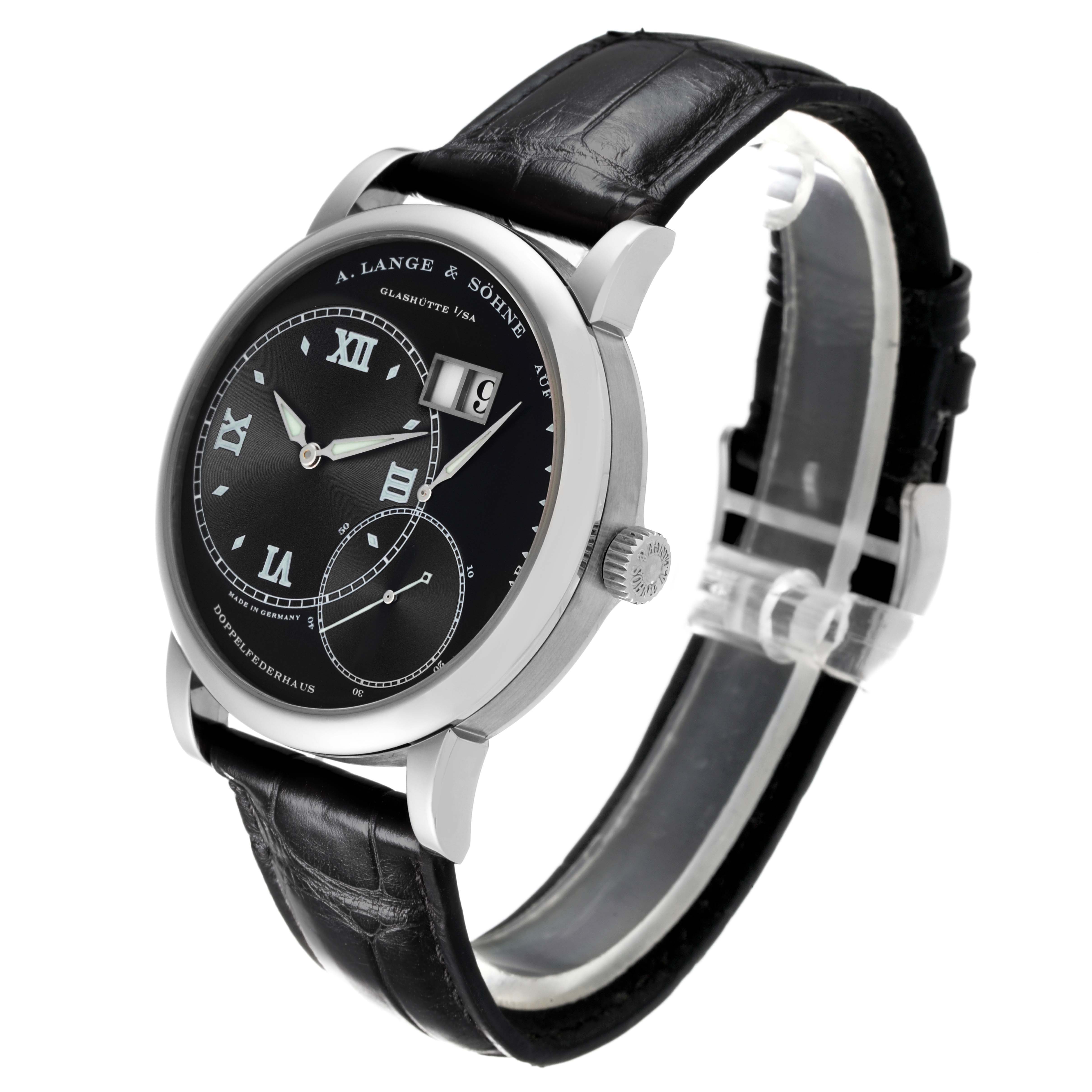 The Lange 1 watch by A. Lange & Söhne is shown from a three-quarter angle, highlighting the face, crown, and leather strap.