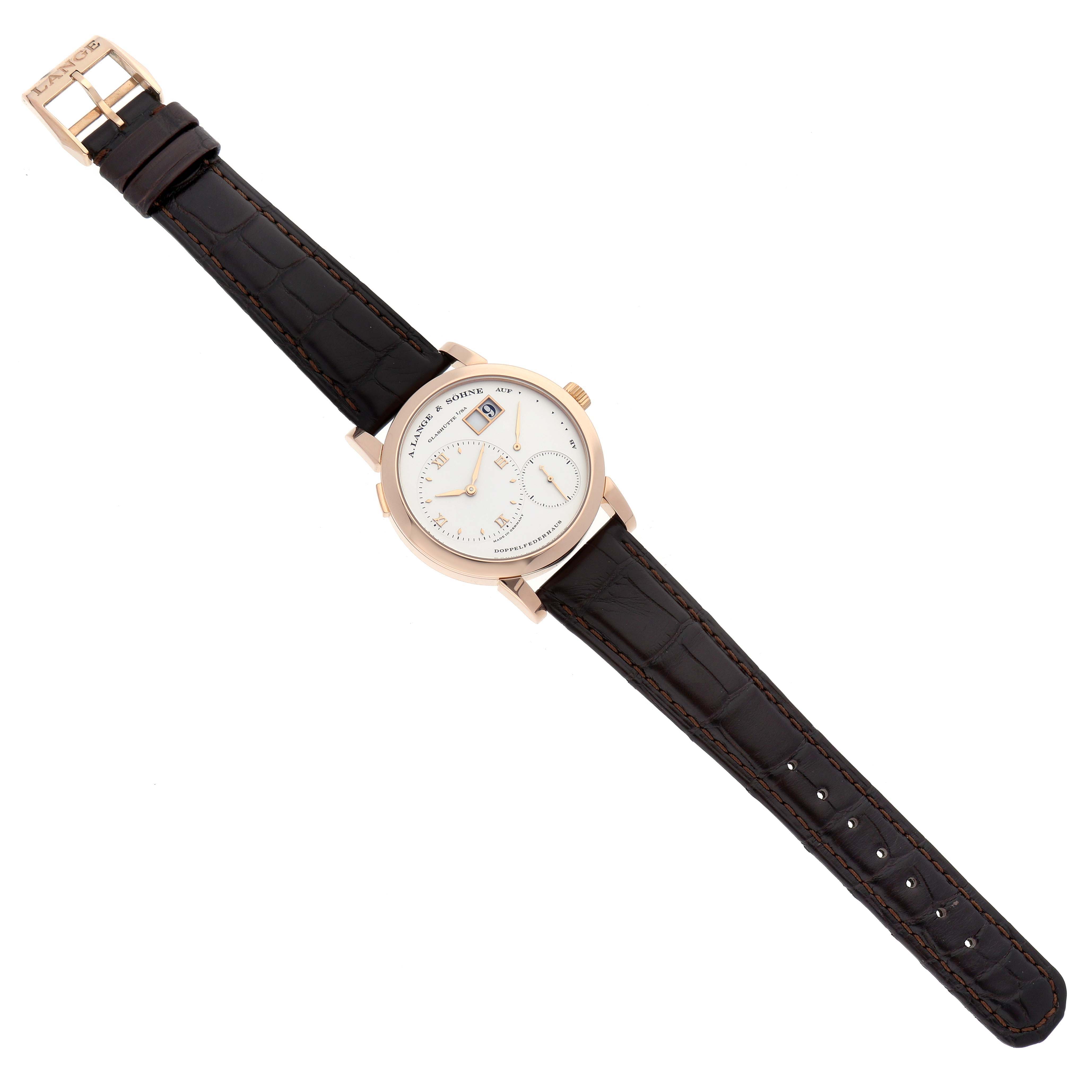 The Lange 1 model by A. Lange & Söhne is shown flat, displaying the dial, case, crown, and leather strap with a deployment buckle.