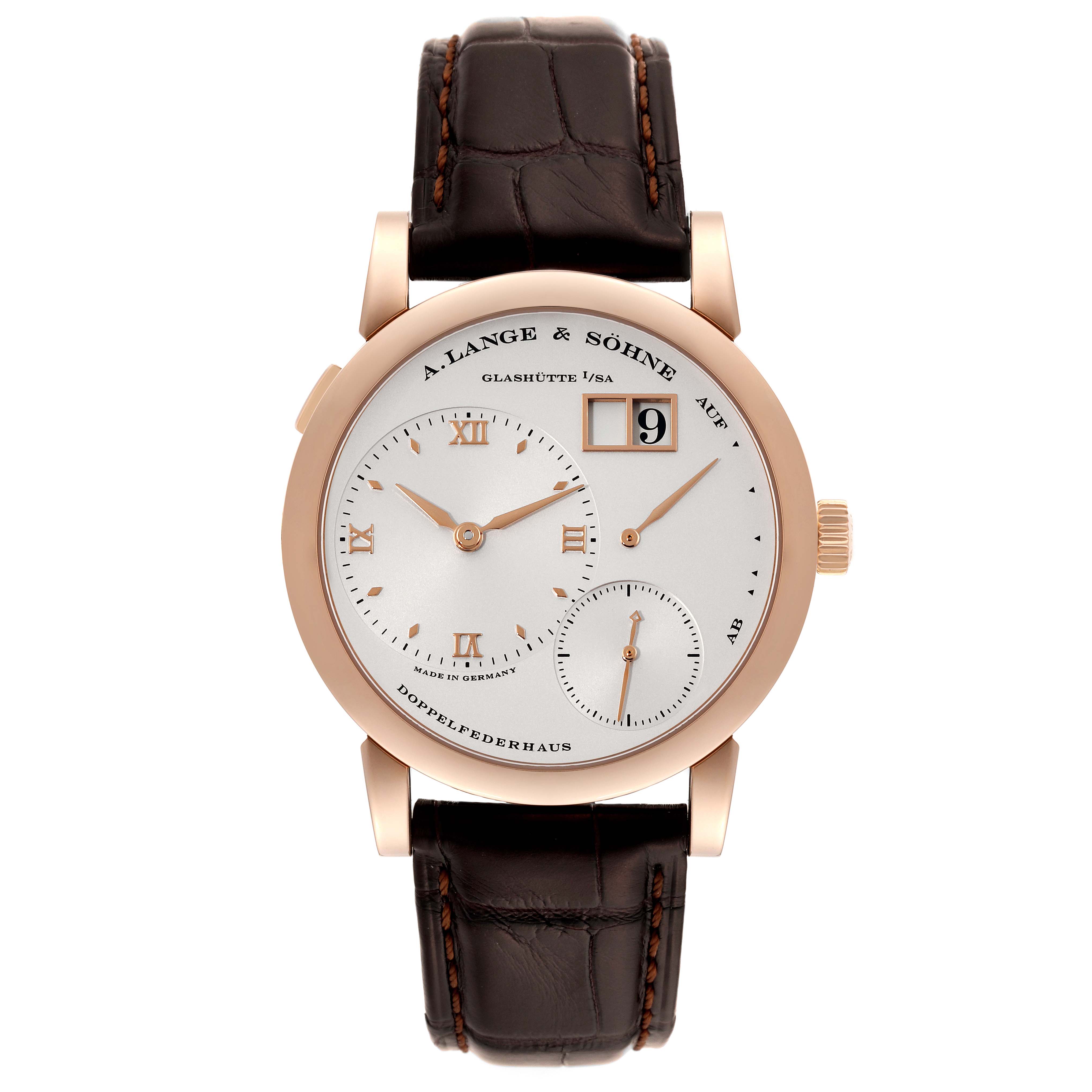 The image shows the A. Lange & Sohne Lange 1 101.032 Men's Rose Gold Silver Dial watch from a front angle, featuring its dial, hands, and leather strap.