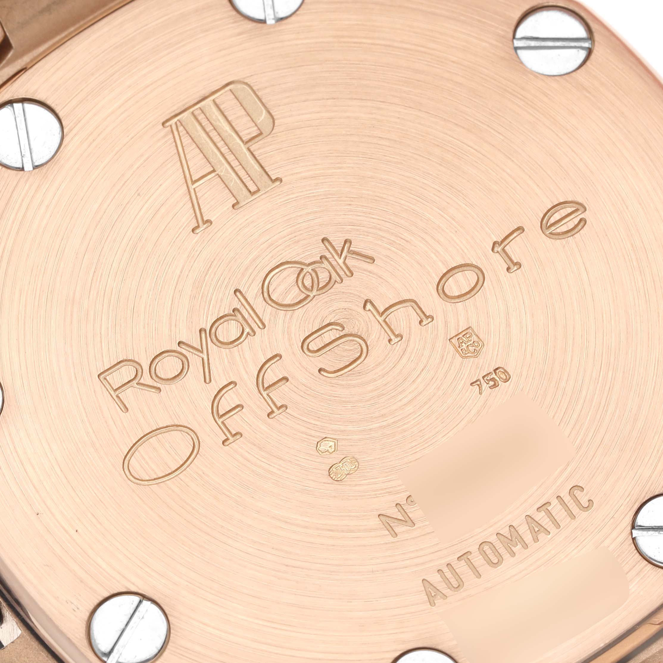 The image shows the case back of the Audemars Piguet Royal Oak Offshore 2590OK.OO.D002CA.01 Men's Rose Gold Grey Dial 2590OK.OO.D002CA.01 Men's Rose Gold Grey Dial watch at a close-up angle.
