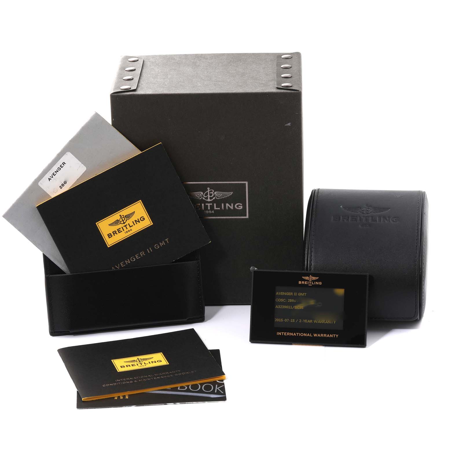 The image shows the packaging and accessories for a Breitling Avenger A32390 Men's Stainless Steel Black Dial A32390 Men's Stainless Steel Black Dial watch, including boxes, manuals, and warranty cards.