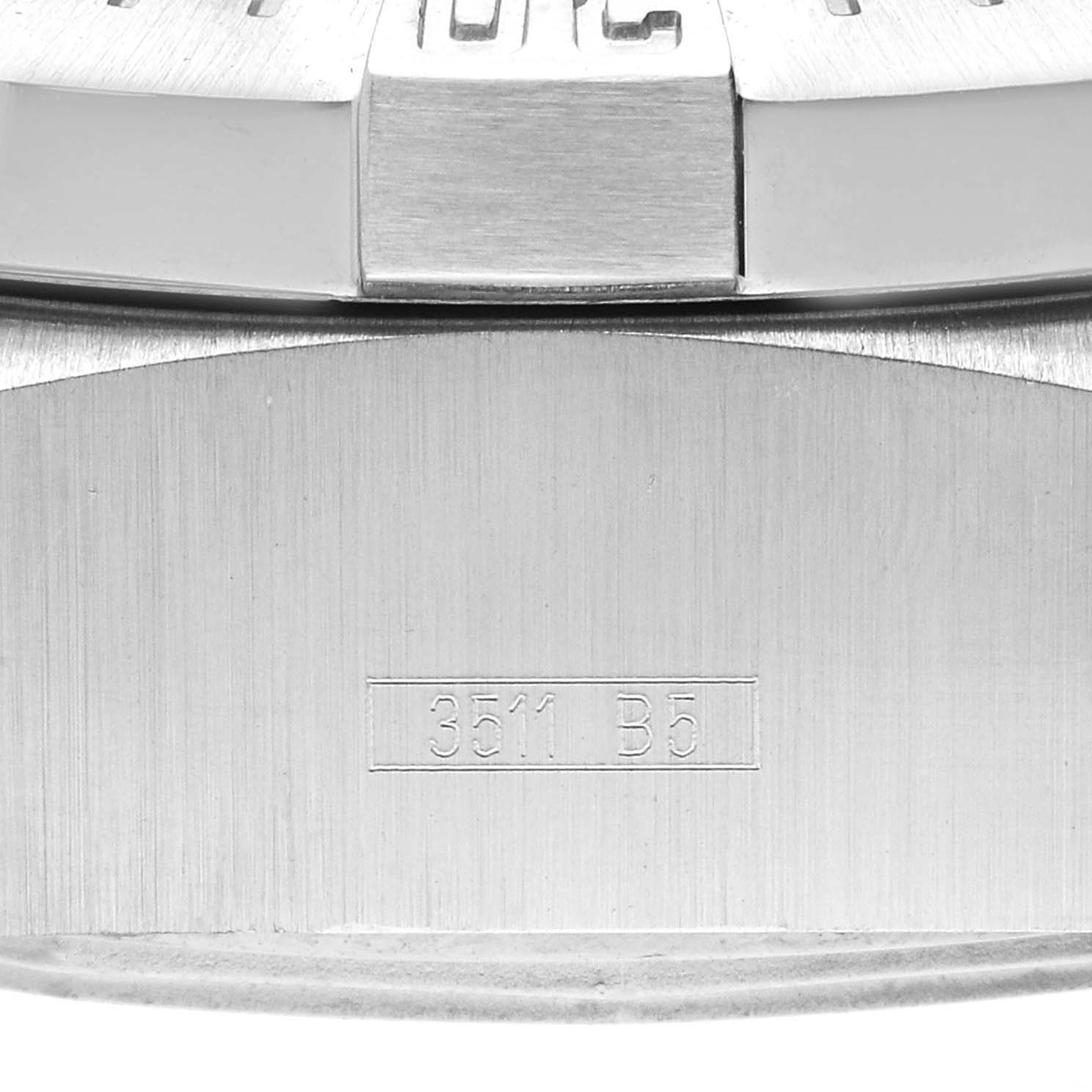This close-up image shows the serial number and part of the bezel and case of a Breitling Avenger A17330 Men's Stainless Steel Black Dial A17330 Men's Stainless Steel Black Dial watch.