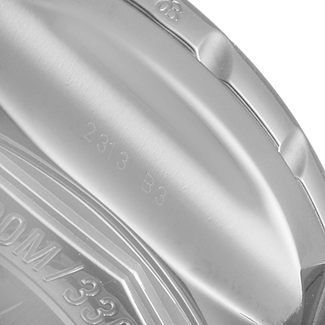 This image shows a close-up of the back and edge of the bezel of a Bentley model watch by Breitling.