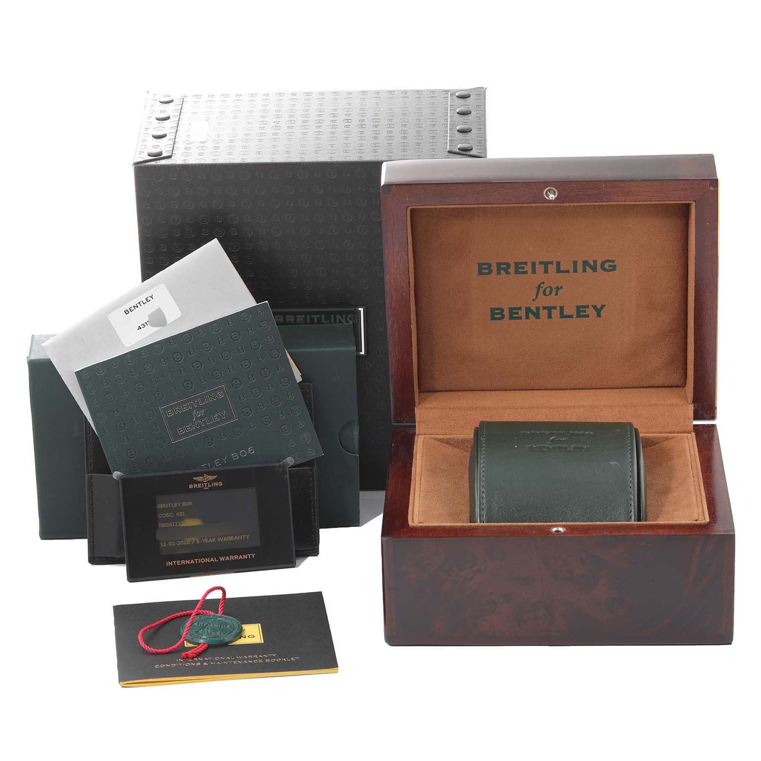 The image shows packaging and accessories for the Bentley model by Breitling, including a wooden box, warranty card, and manuals.