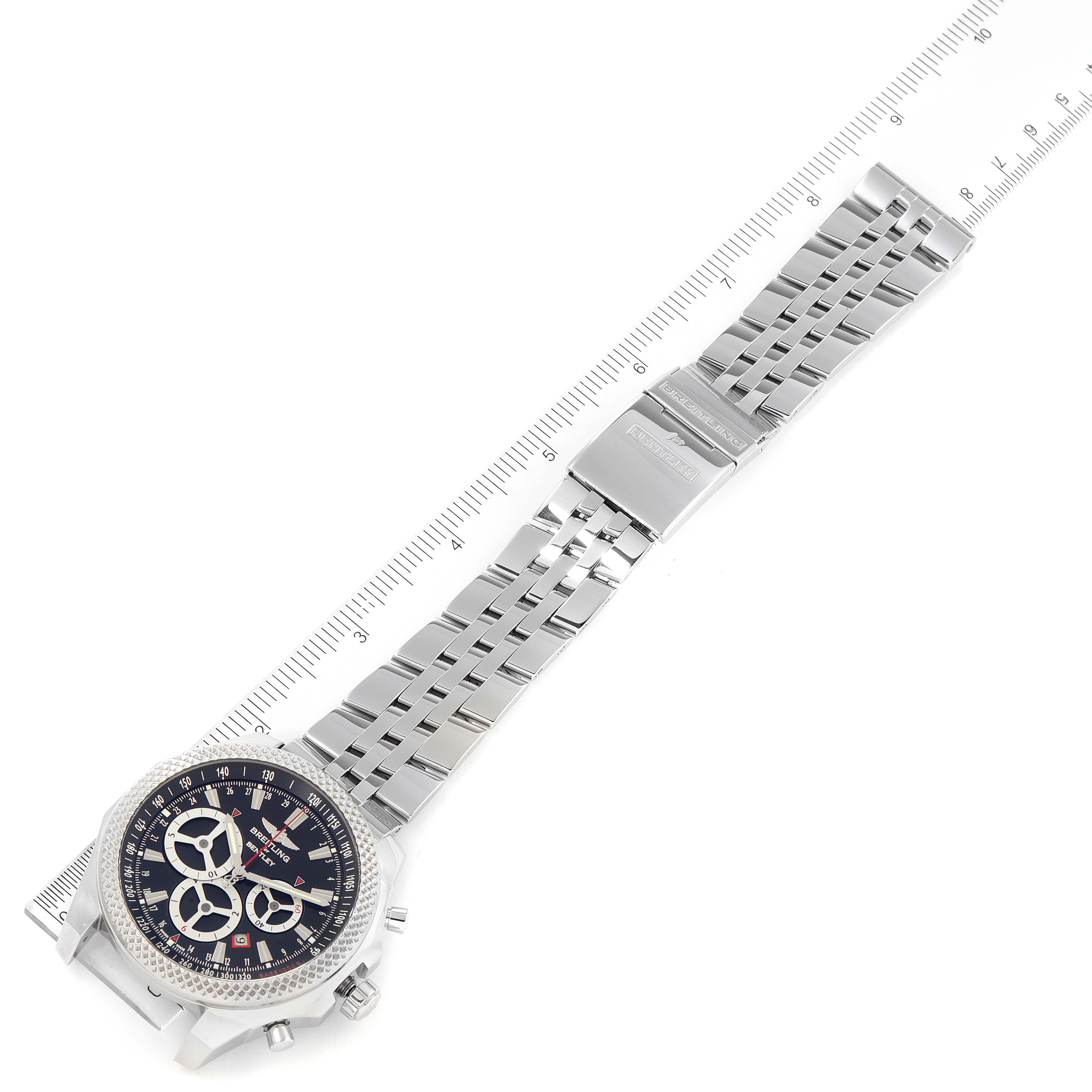 The image shows a Breitling Bentley A25366 Men's Stainless Steel Black Dial A25366 Men's Stainless Steel Black Dial watch laid flat, showcasing the face and stainless steel bracelet with a ruler for scale.