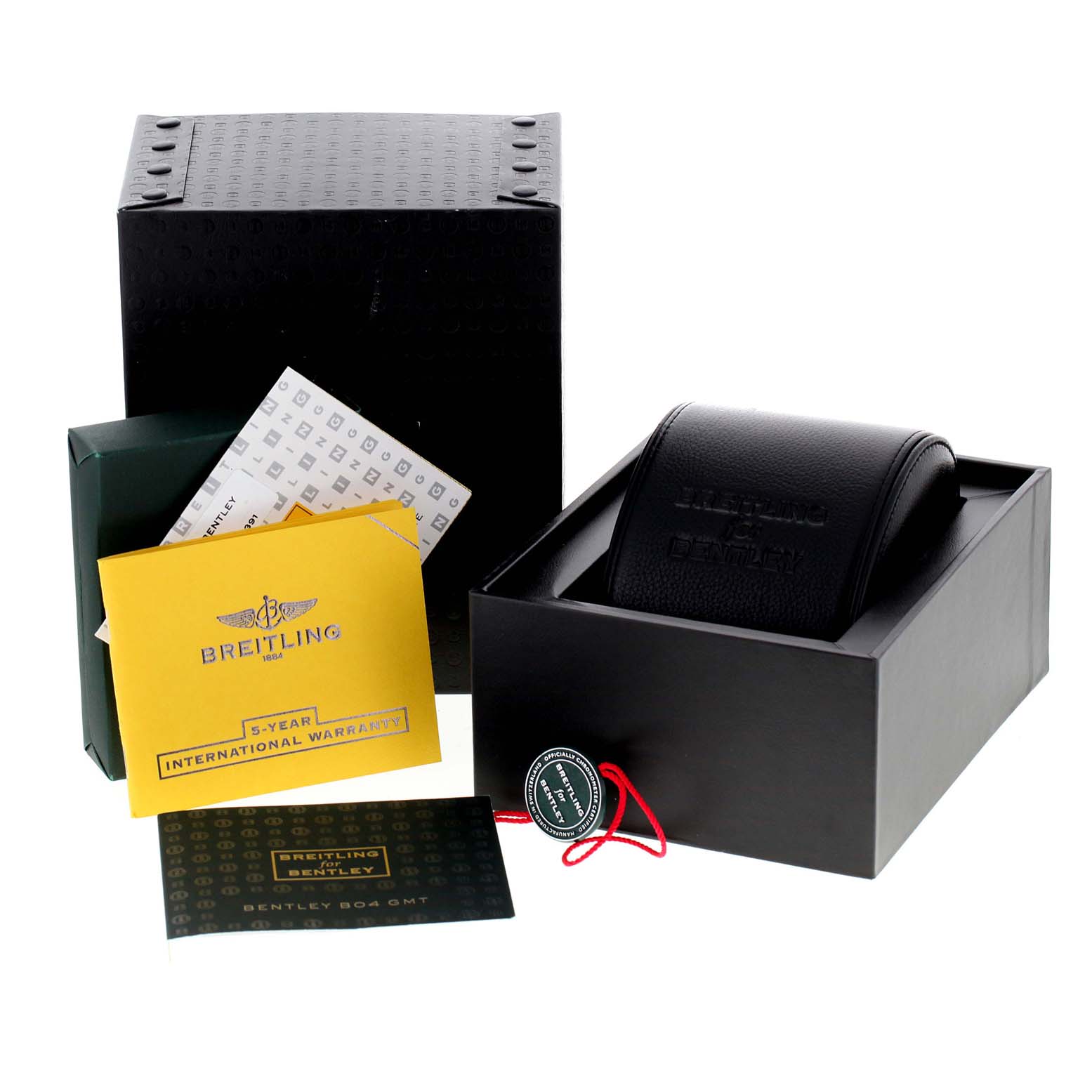 The image shows the packaging and accessories for a Breitling Bentley AB0431 Men's Stainless Steel Silver Dial AB0431 Men's Stainless Steel Silver Dial watch, including a box, warranty card, and watch case.