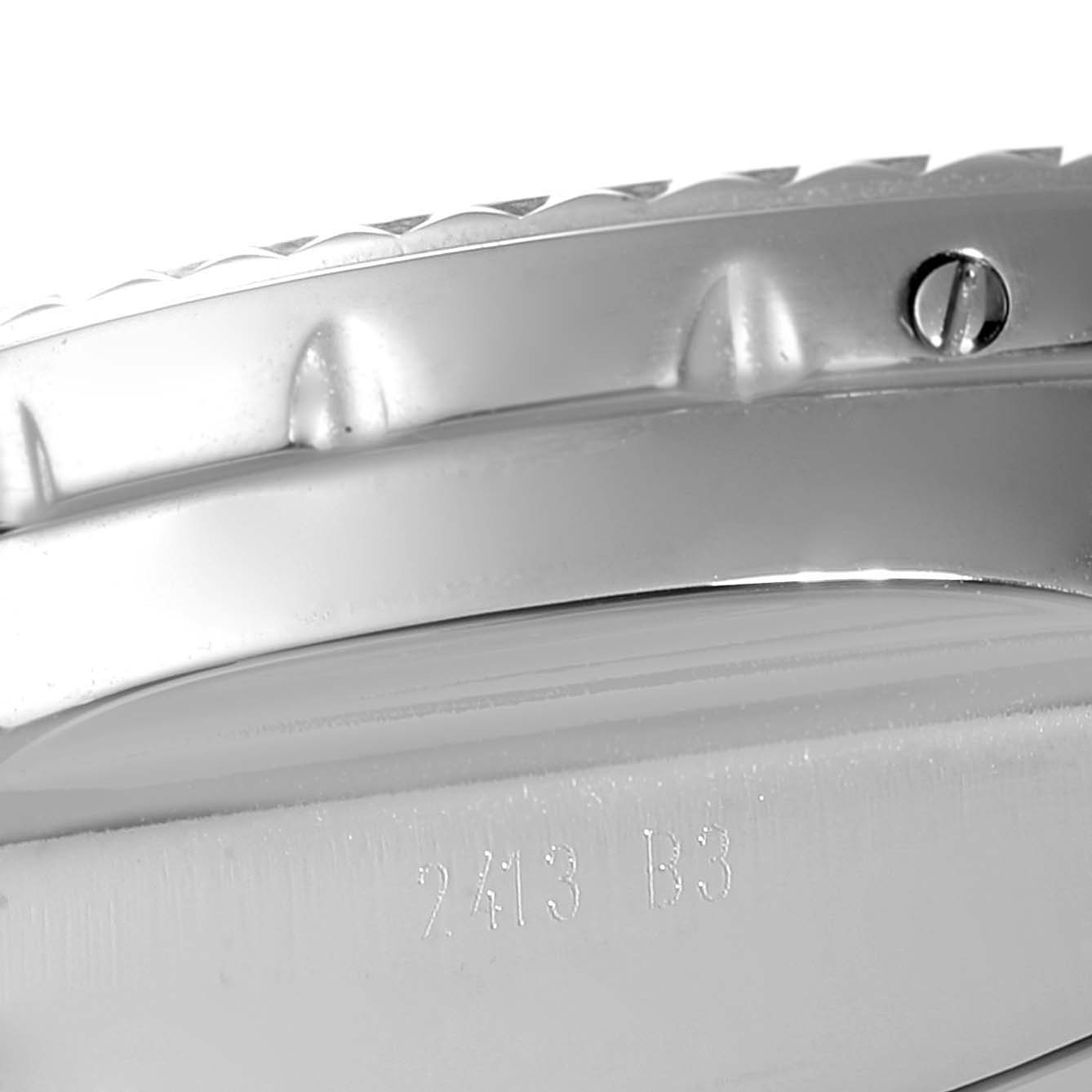 The image shows a close-up side view of the Breitling Bentley AB0431 Men's Stainless Steel Silver Dial AB0431 Men's Stainless Steel Silver Dial watch case with visible serial number and part of the bezel.