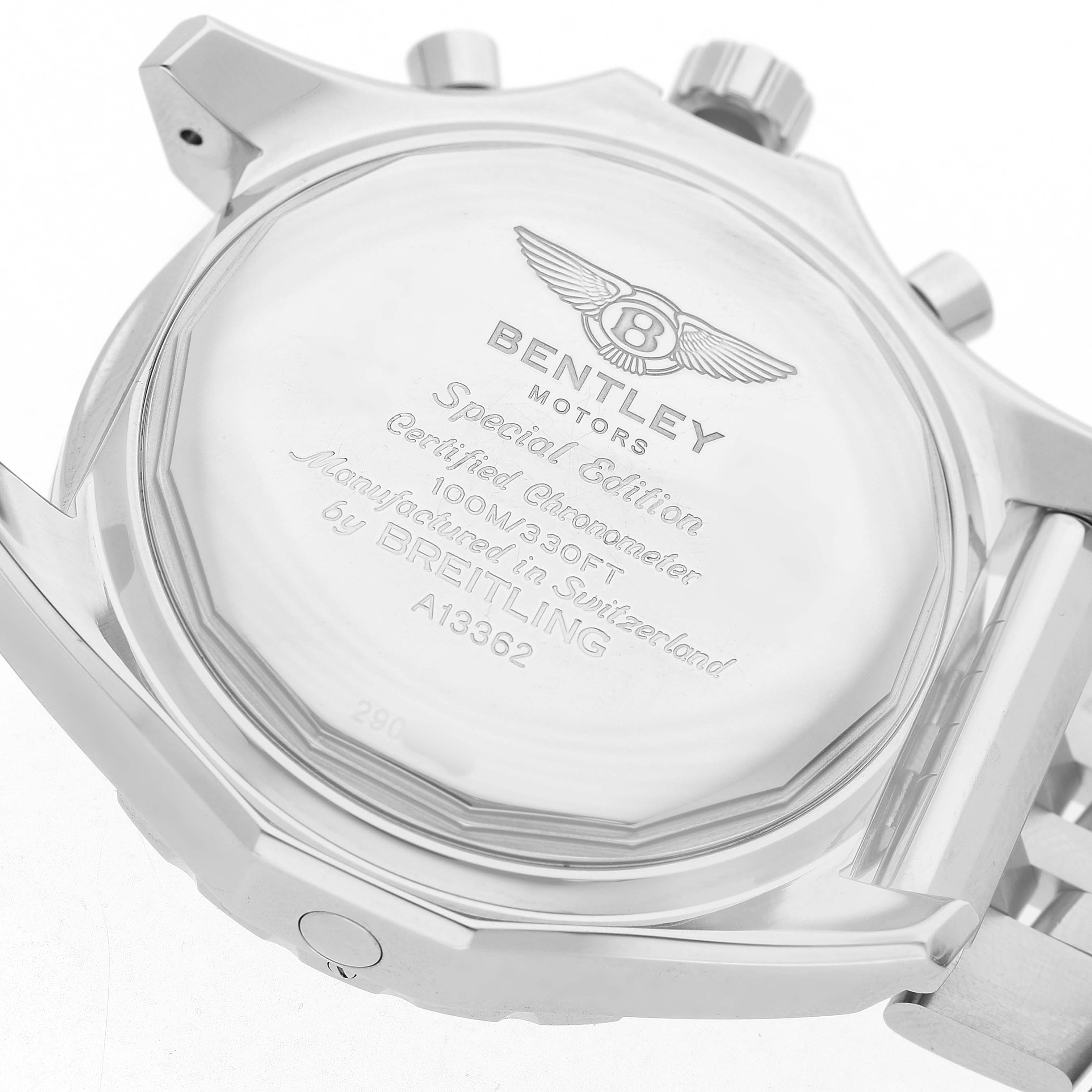 The image shows the back case of a Breitling Bentley A13362 Men's Stainless Steel Mother of Pearl Dial model watch, highlighting its engraved details and metal bracelet attachment.