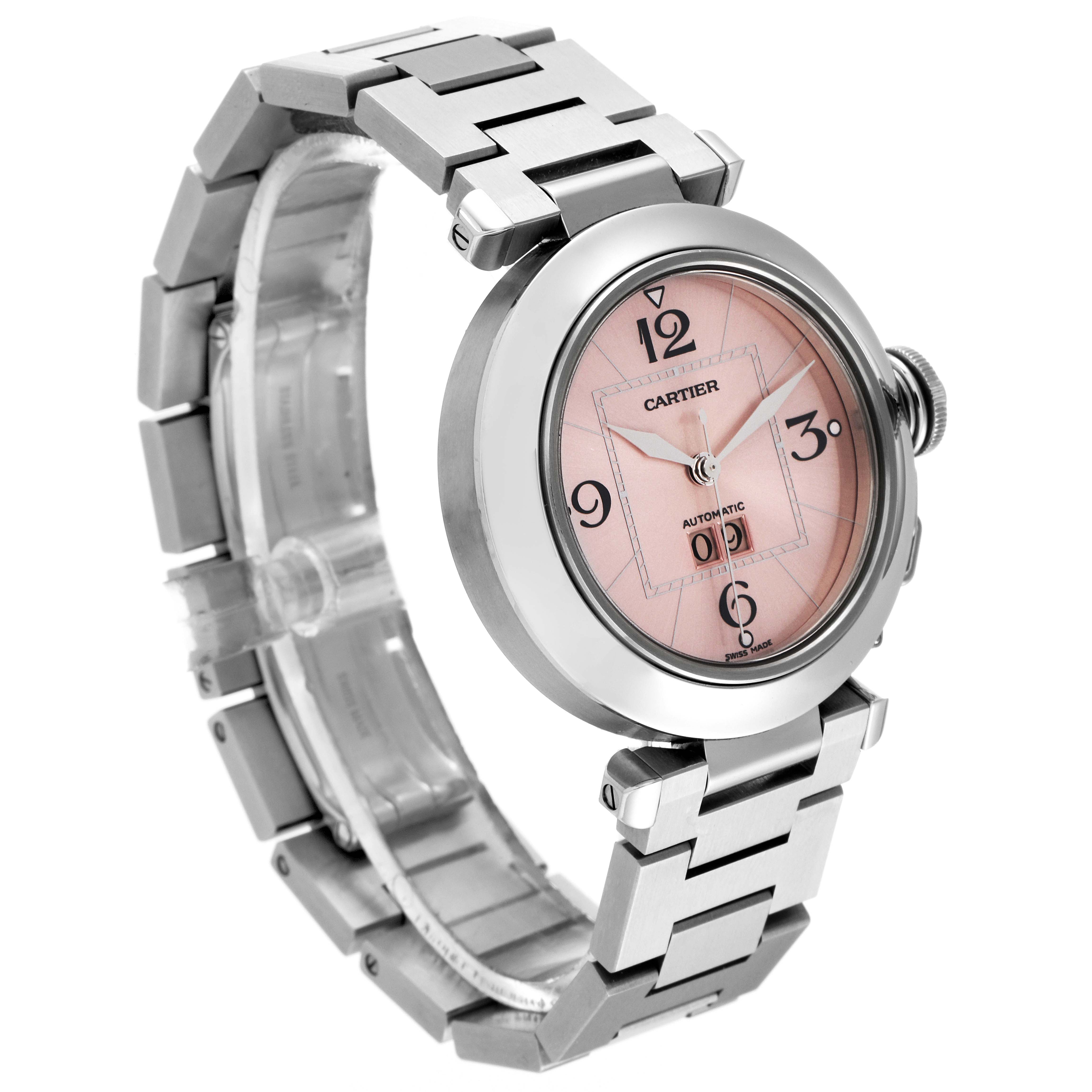The image shows a Cartier Pasha W31058M7 Women's Stainless Steel Pink Dial W31058M7 Women's Stainless Steel Pink Dial watch at a three-quarter angle, highlighting its pink dial, stainless steel bracelet, and crown.