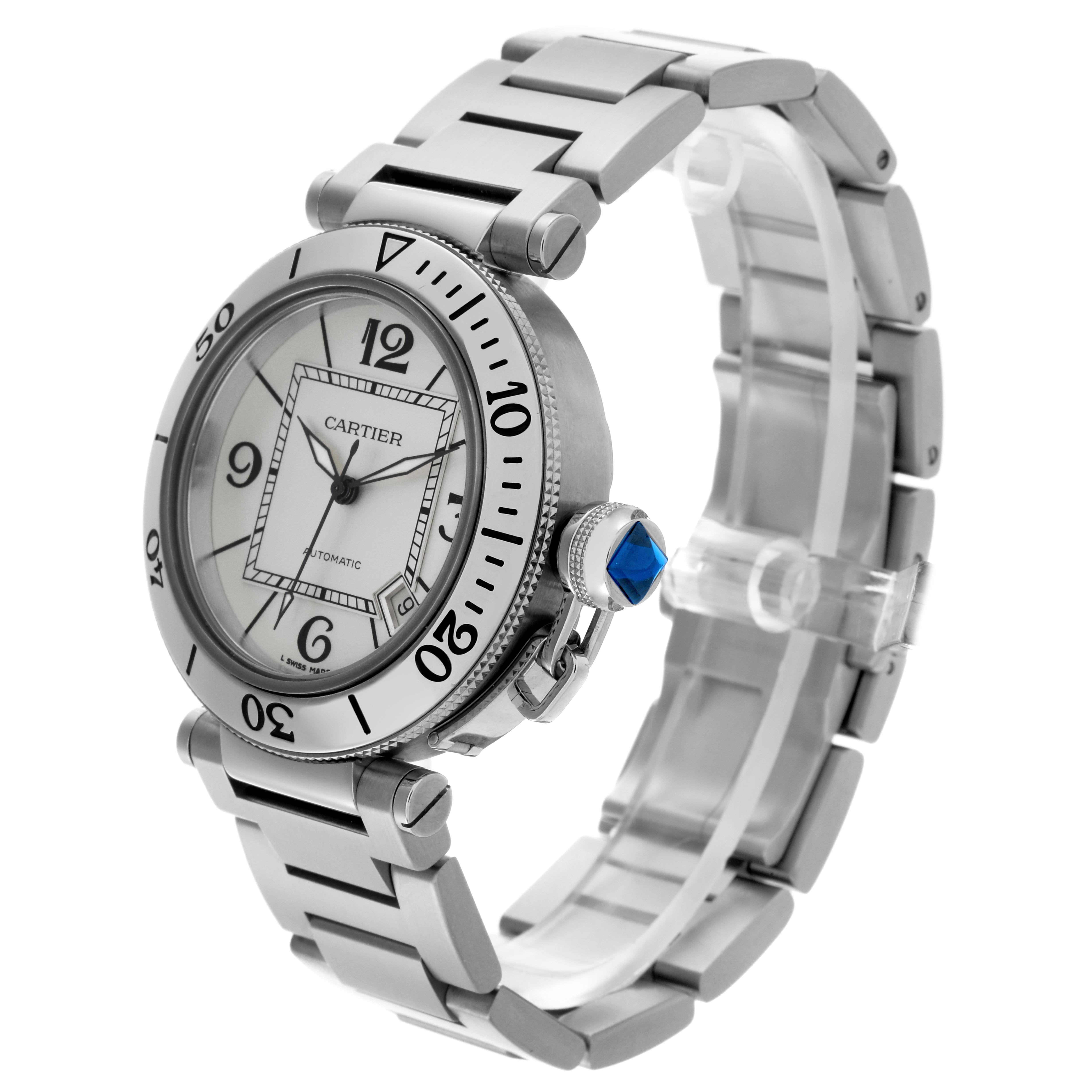 The Cartier Pasha W31080M7 Men's Stainless Steel Silver Dial W31080M7 Men's Stainless Steel Silver Dial watch is shown at an angle displaying the face, bezel, crown with a blue gem, and part of the bracelet.