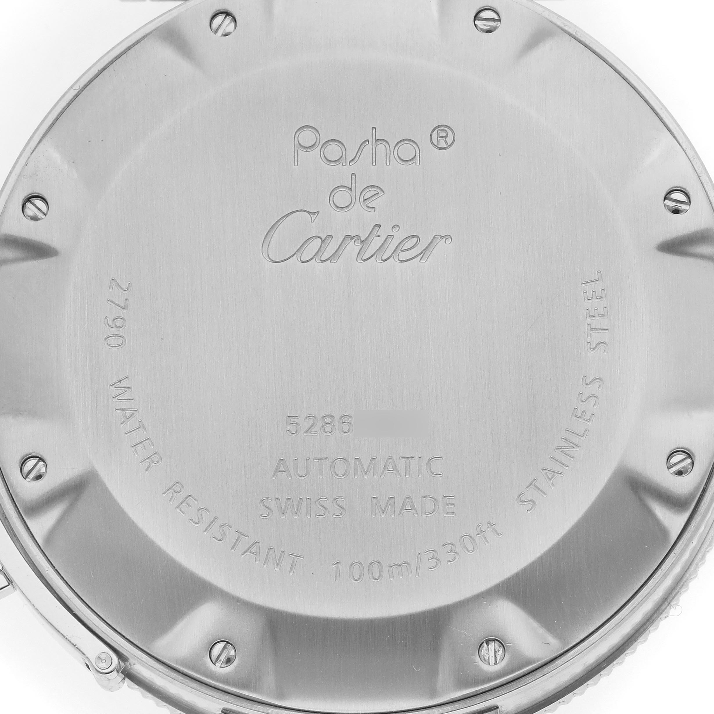 The image shows the back casing of the Pasha de Cartier watch, featuring engraved details and screws.