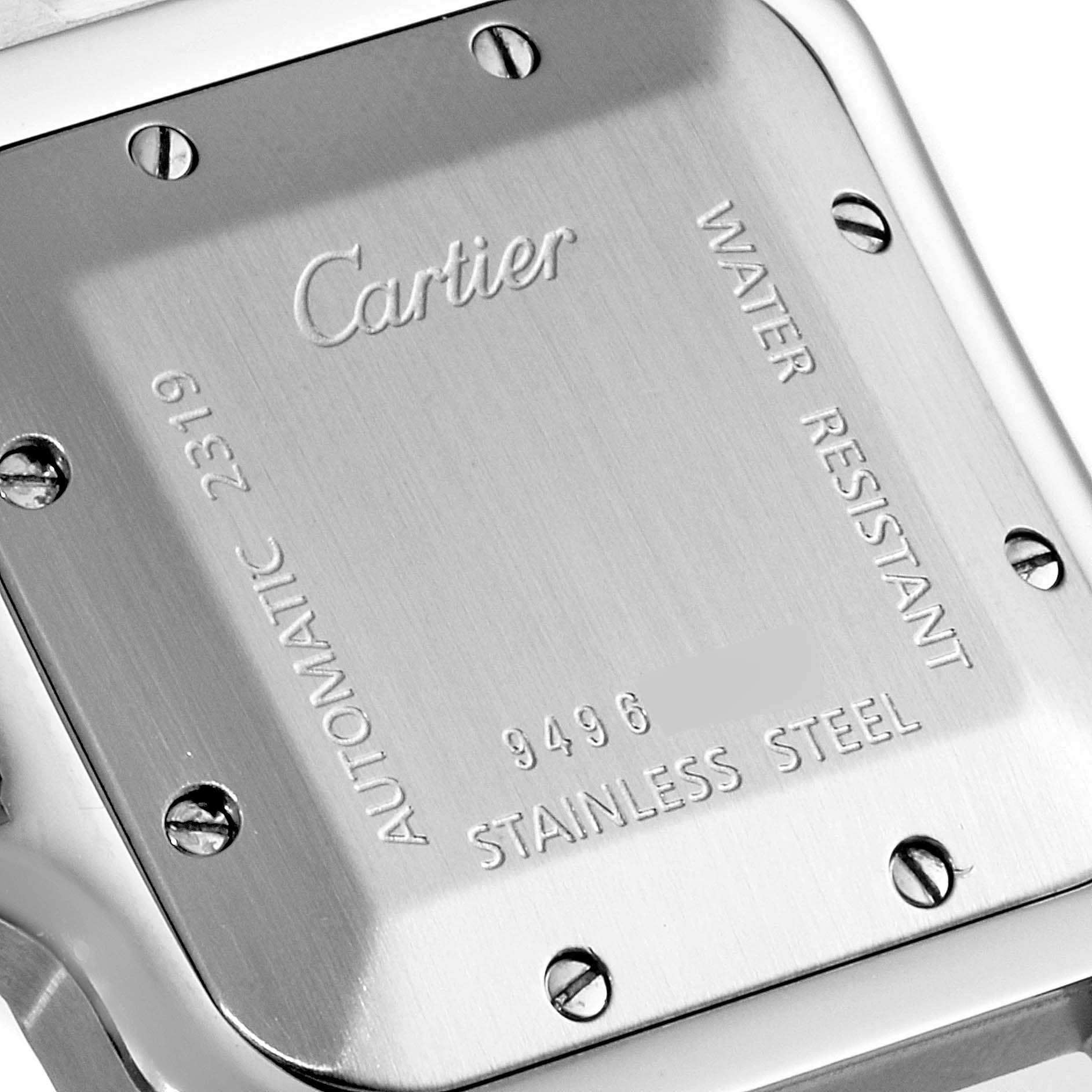 The image shows the backside of a Cartier Santos W20055D6 Men's Stainless Steel Silver Dial W20055D6 Men's Stainless Steel Silver Dial watch, displaying the screws, engravings, and metal finish.