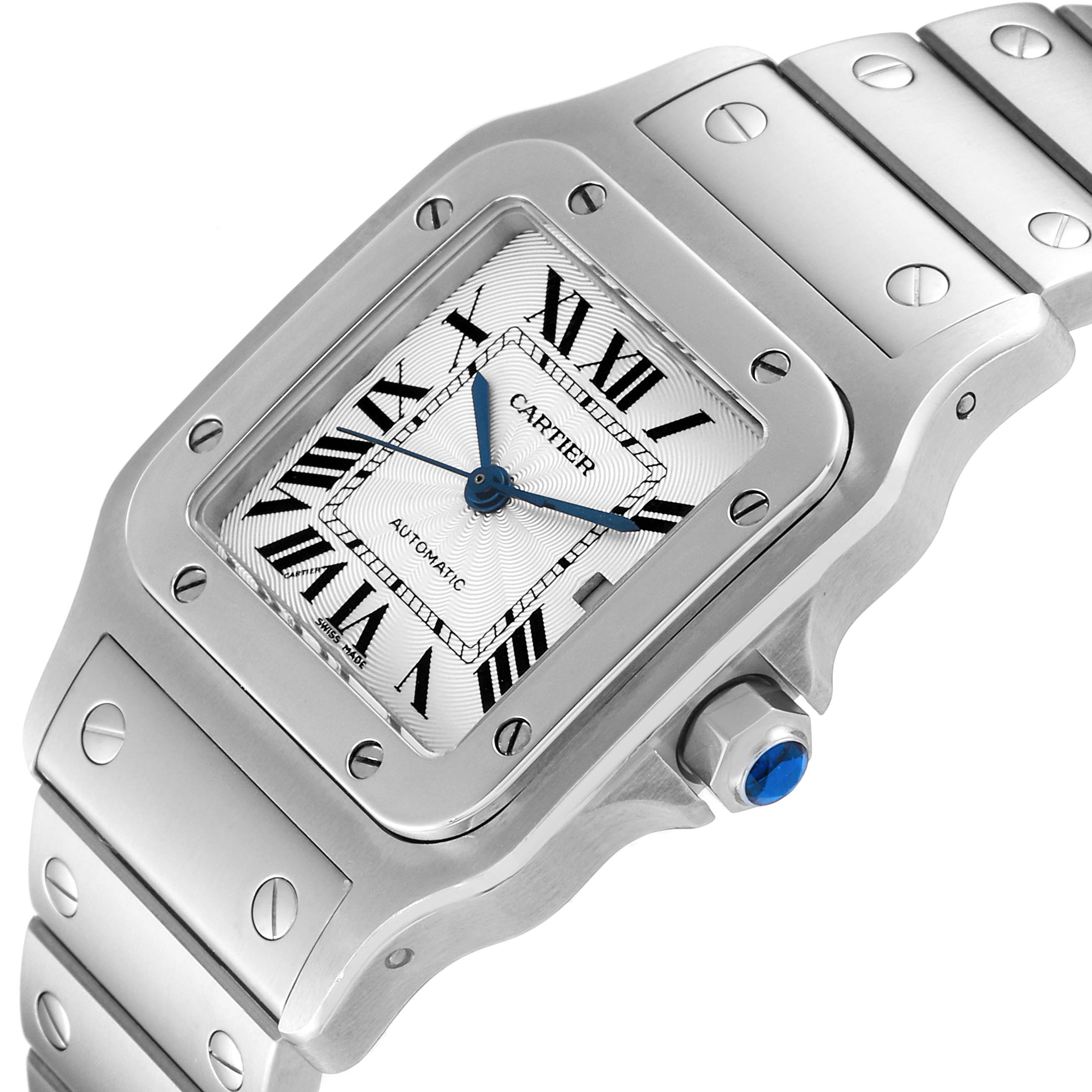 This image shows a Santos model watch by Cartier from a diagonal angle, highlighting its face, crown, and part of the band.
