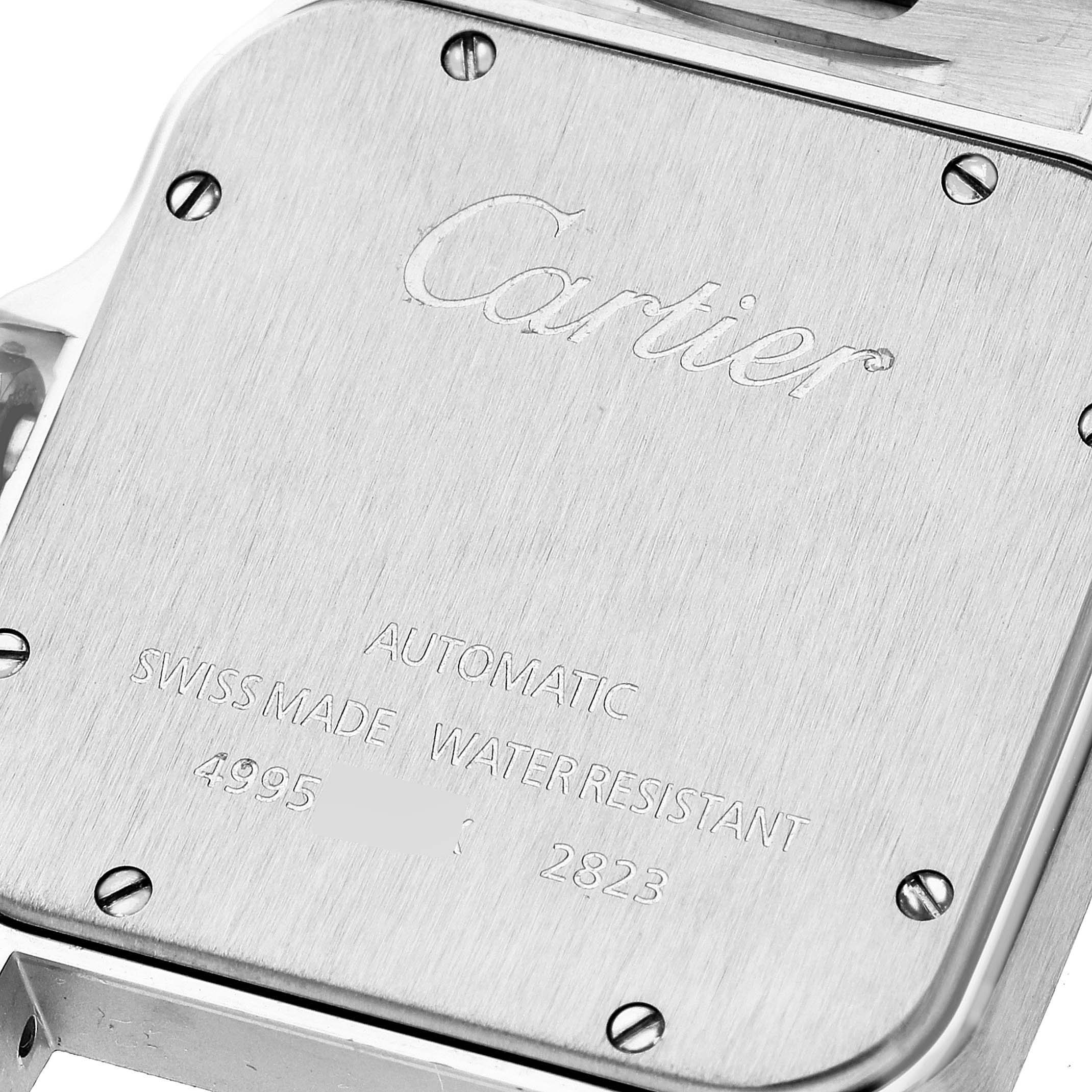 The image shows the back cover of a Cartier Santos W20099C4 Men
s Steel and Gold (two tone) Silver Dial W20099C4 Men
s Steel and Gold (two tone) Silver Dial watch, featuring its engravings and screw details.
