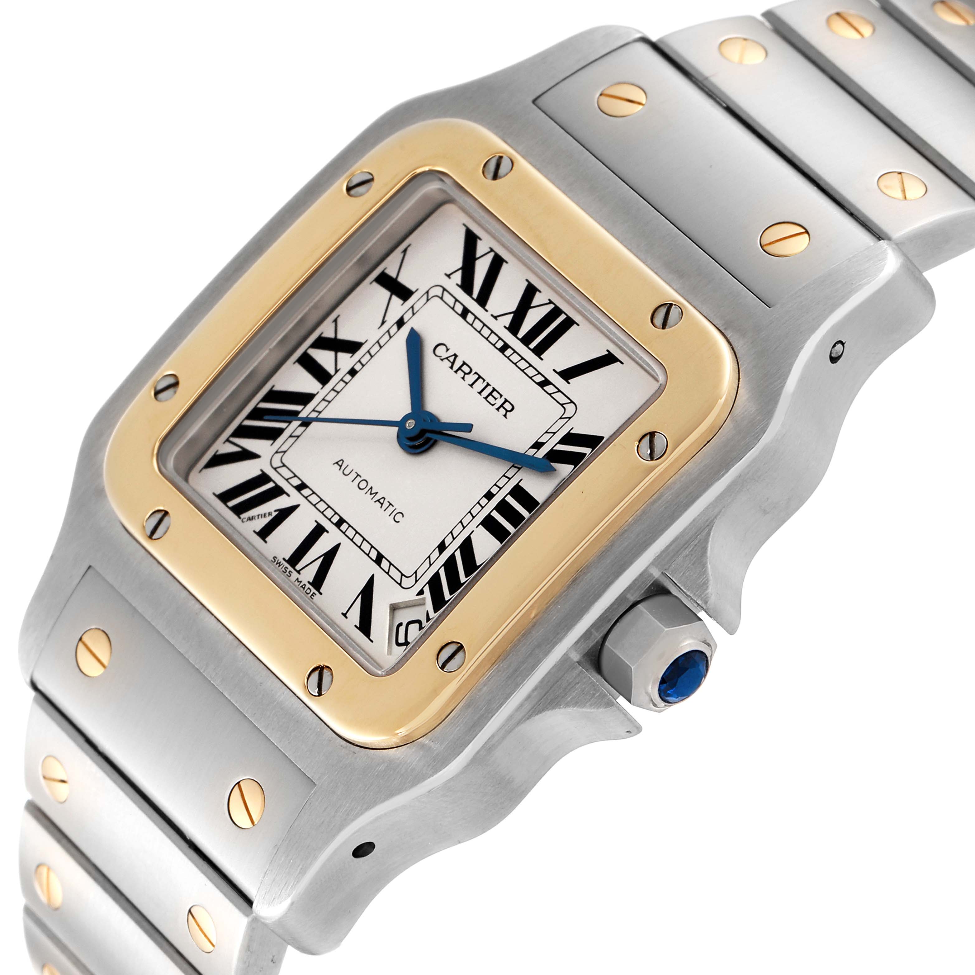 The image displays a Cartier Santos W20099C4 Men
s Steel and Gold (two tone) Silver Dial W20099C4 Men
s Steel and Gold (two tone) Silver Dial watch from a front-left angle, showcasing the dial, bezel, crown, and part of the bracelet.