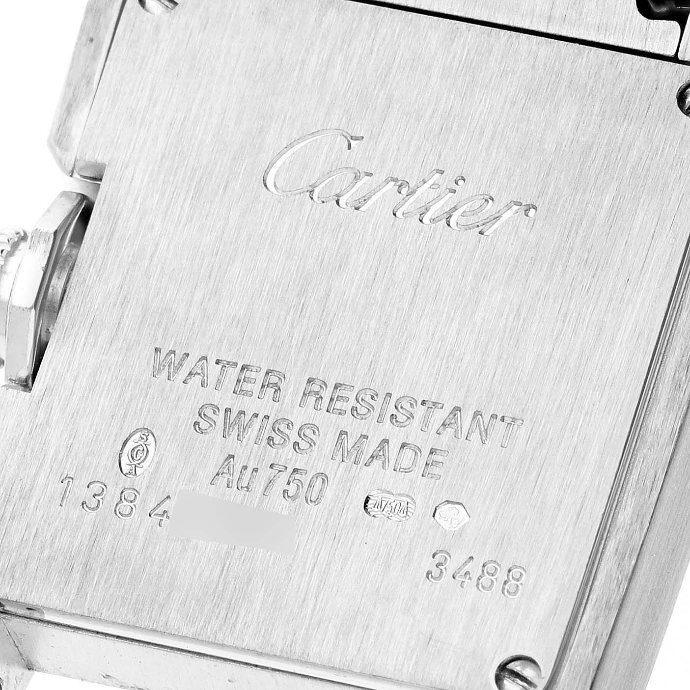 This image shows a close-up of the back case of a Cartier Tank Anglaise WT100008 Women's White Gold Silver Dial WT100008 Women's White Gold Silver Dial watch, highlighting its engravings and markings.