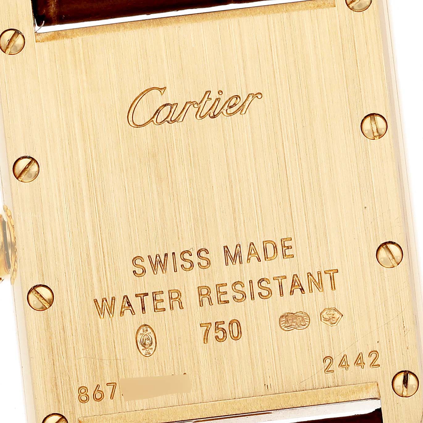 This image shows a close-up of the back case of a Cartier Tank Louis W1529856 Women's Yellow Gold Silver Dial W1529856 Women's Yellow Gold Silver Dial watch, highlighting the engraved details and screws.