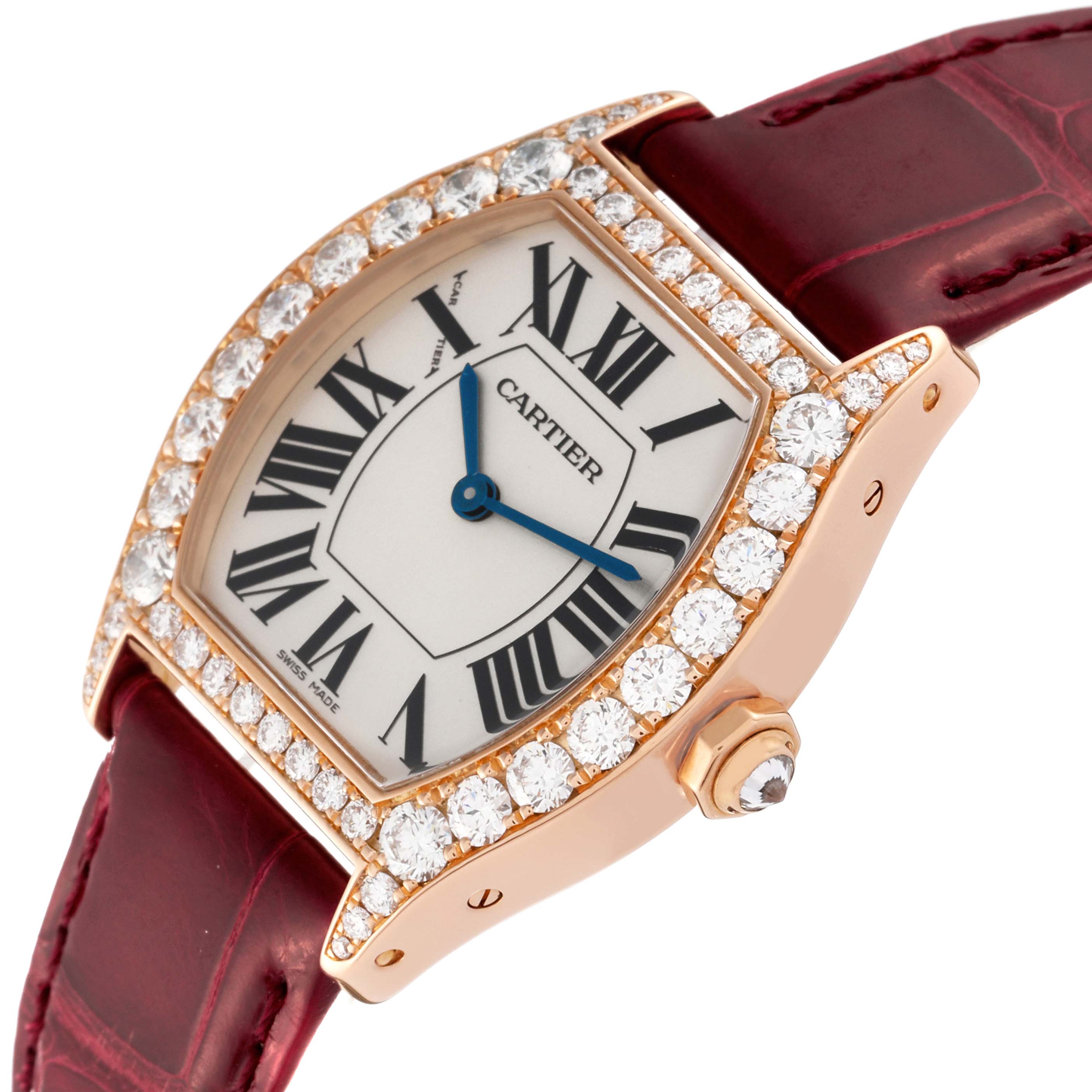 This image shows a Cartier Tortue WA507031 Women
s Rose Gold Silver Dial WA507031 Women
s Rose Gold Silver Dial model watch at an angle, revealing its face, bezel with diamonds, case, and part of the strap.