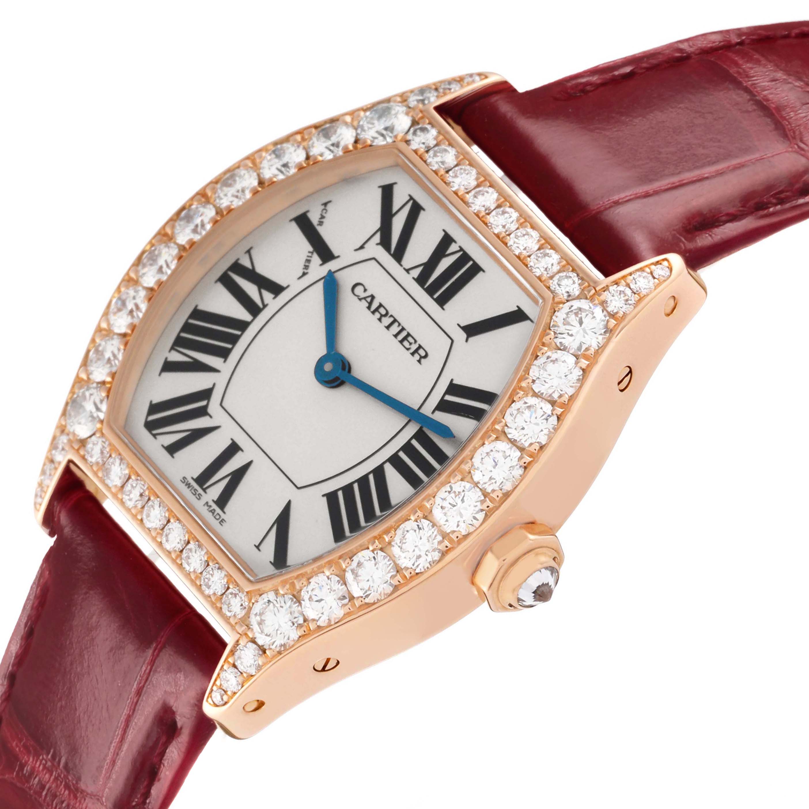 The Cartier Tortue WA507031 Women's Rose Gold Silver Dial watch is shown at an angled view highlighting the diamond bezel, dial, crown, and part of the maroon strap.