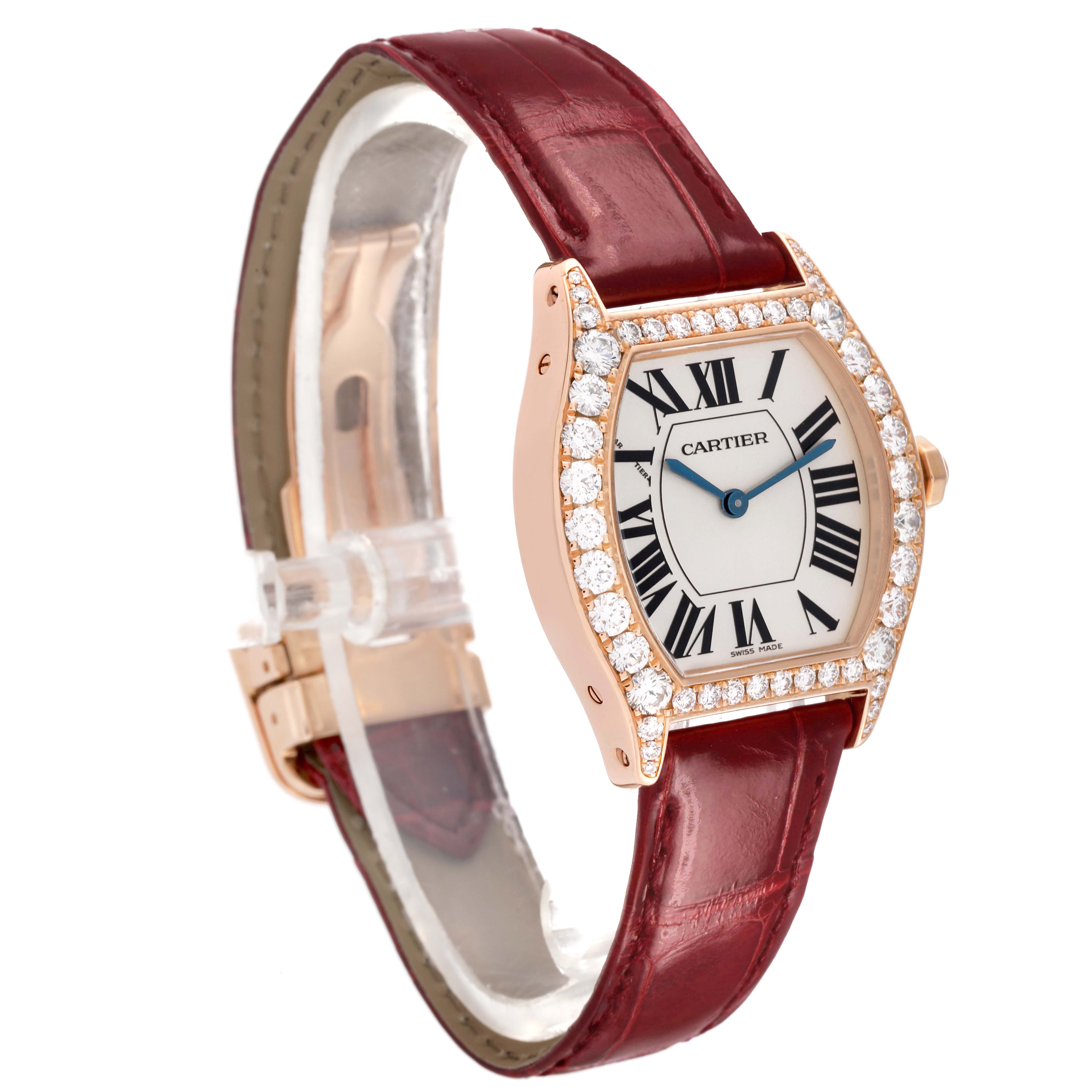 The Cartier Tortue WA507031 Women's Rose Gold Silver Dial watch is shown at a slight side angle, featuring the face, bezel with diamonds, and red leather strap.