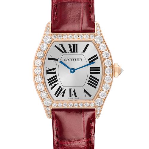 The Cartier Tortue WA507031 Women's Rose Gold Silver Dial watch is shown from a top-down angle, highlighting the diamond-set bezel, dial with Roman numerals, and leather strap.