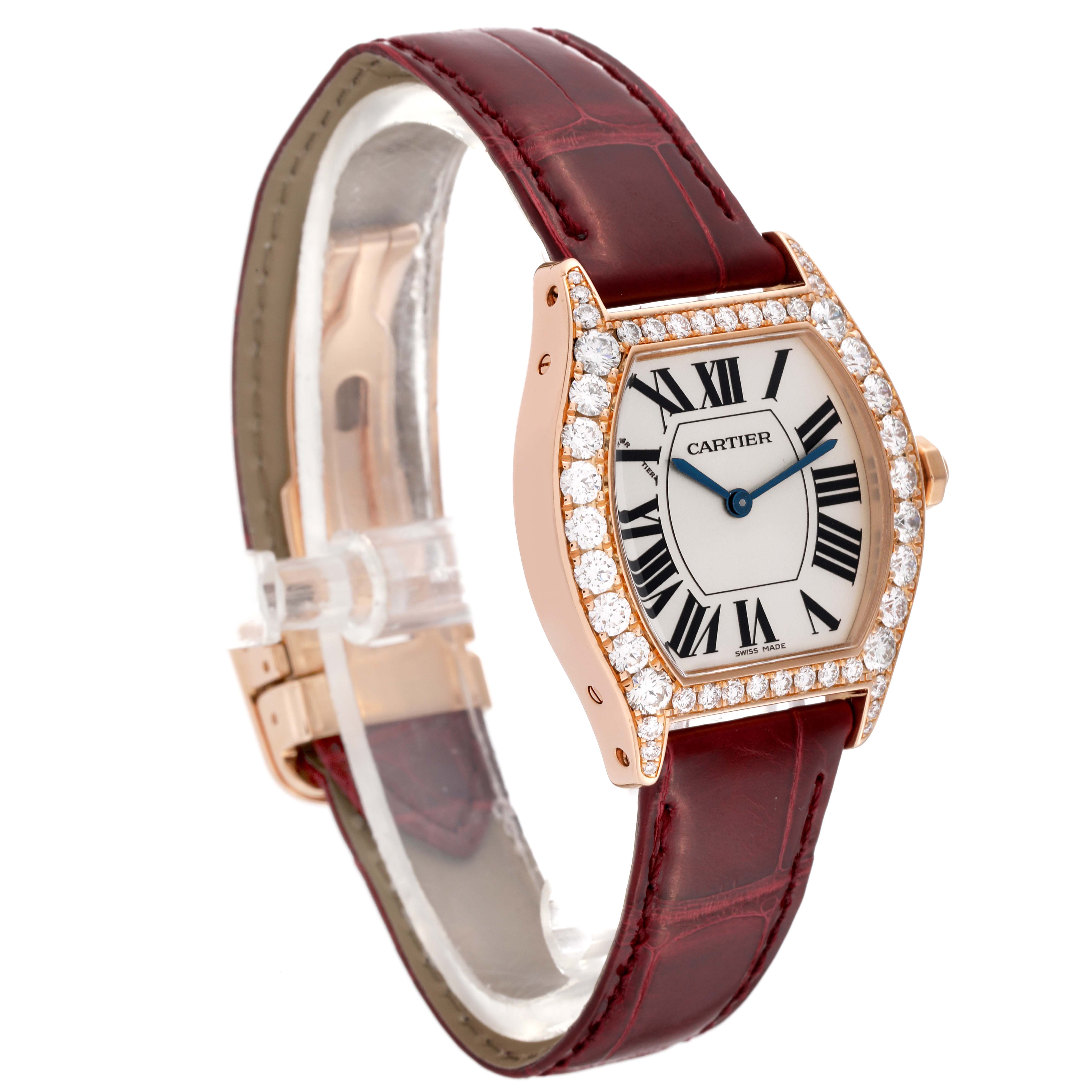 The image shows a Cartier Tortue WA507031 Women
s Rose Gold Silver Dial WA507031 Women
s Rose Gold Silver Dial model watch at a slight angle, highlighting its diamond-studded bezel and maroon leather strap.