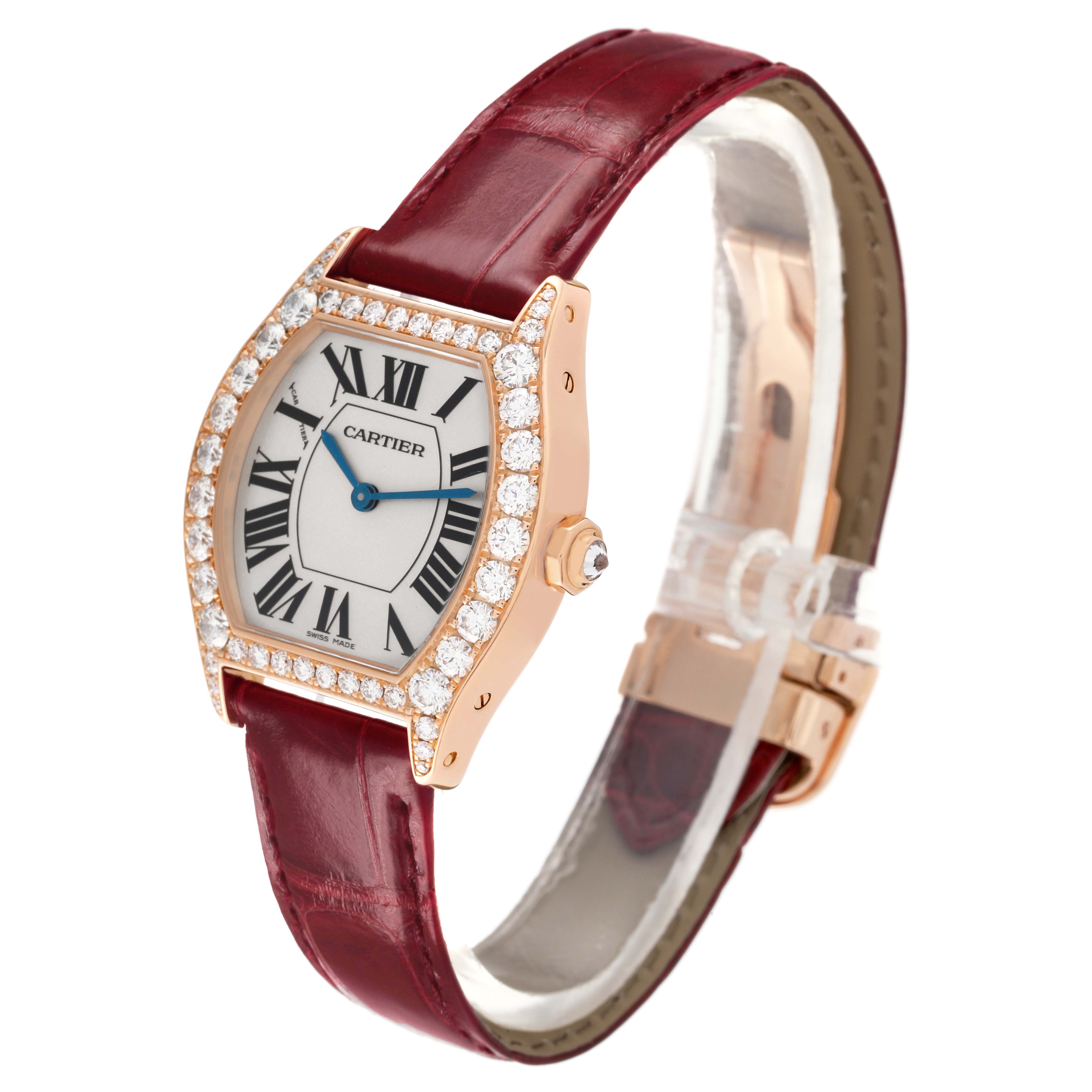 The Cartier Tortue WA507031 Women's Rose Gold Silver Dial watch is shown at a slight angle, highlighting the diamond-encrusted bezel and red leather strap.