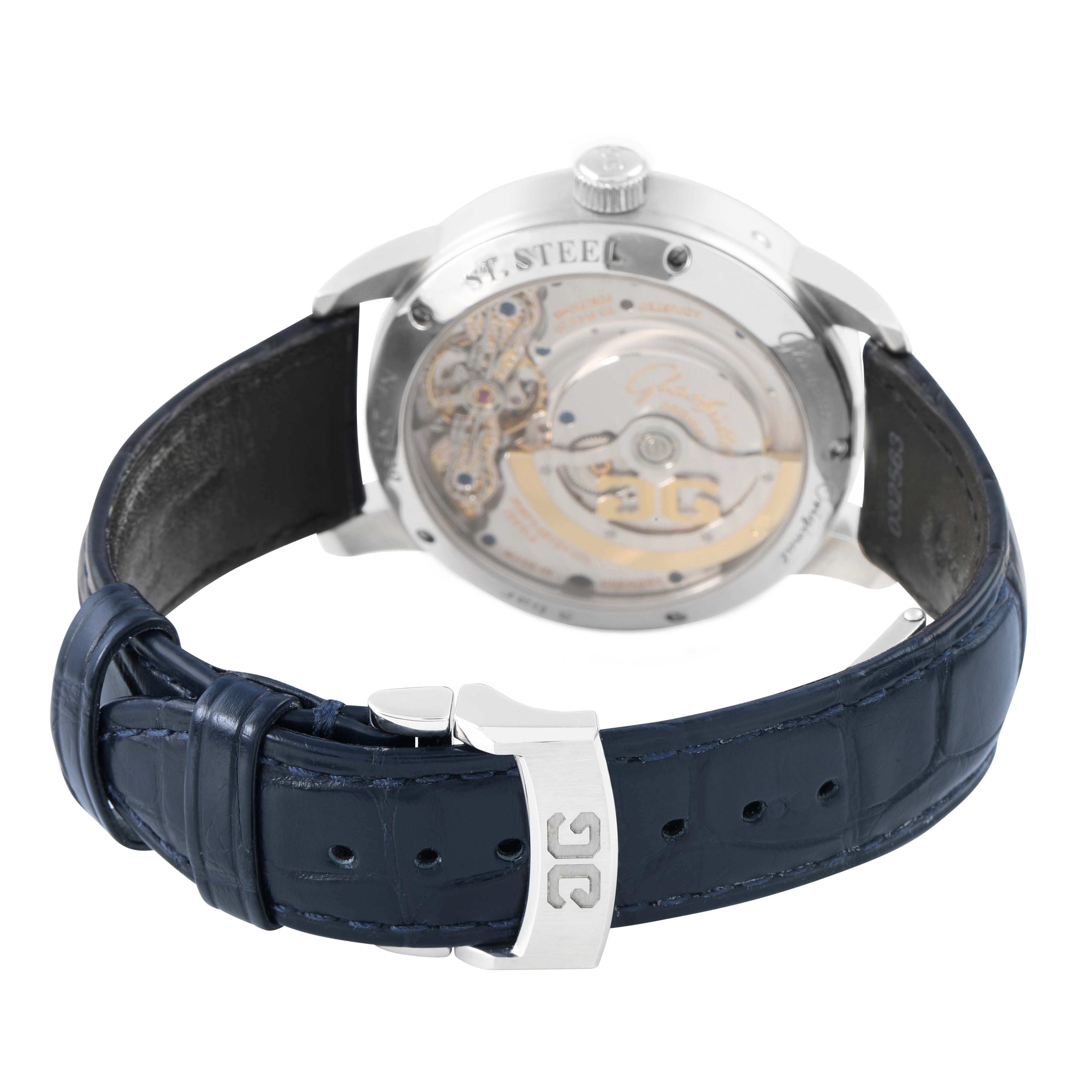 The image shows the back of the Glashütte Pano watch, highlighting the movement and blue leather strap with a buckle.