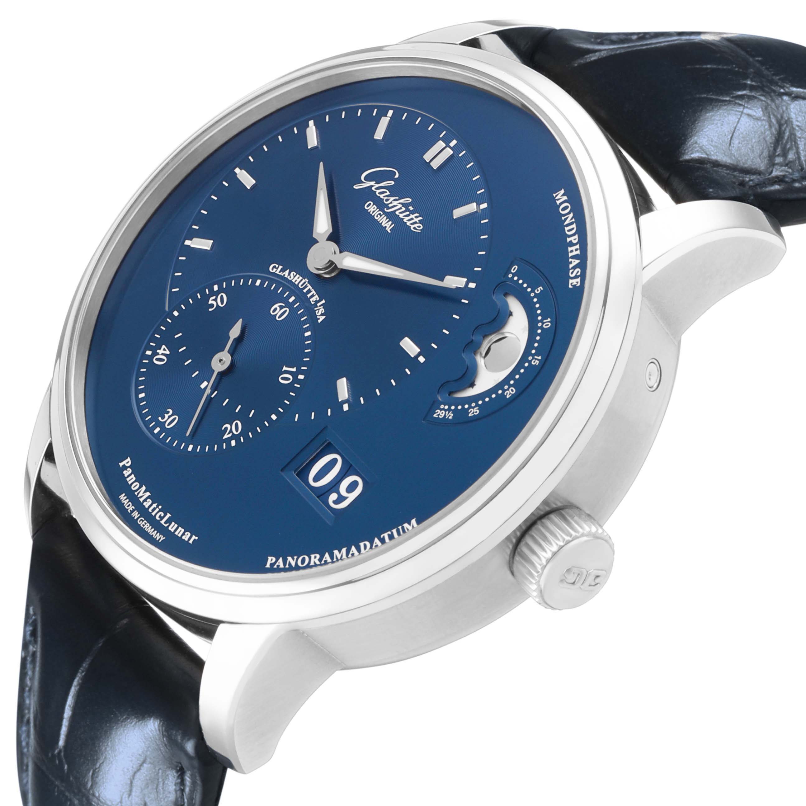 The Glashütte Pano model watch is shown at an angle highlighting its blue dial, moon phase, and leather strap, with a focus on its side profile.
