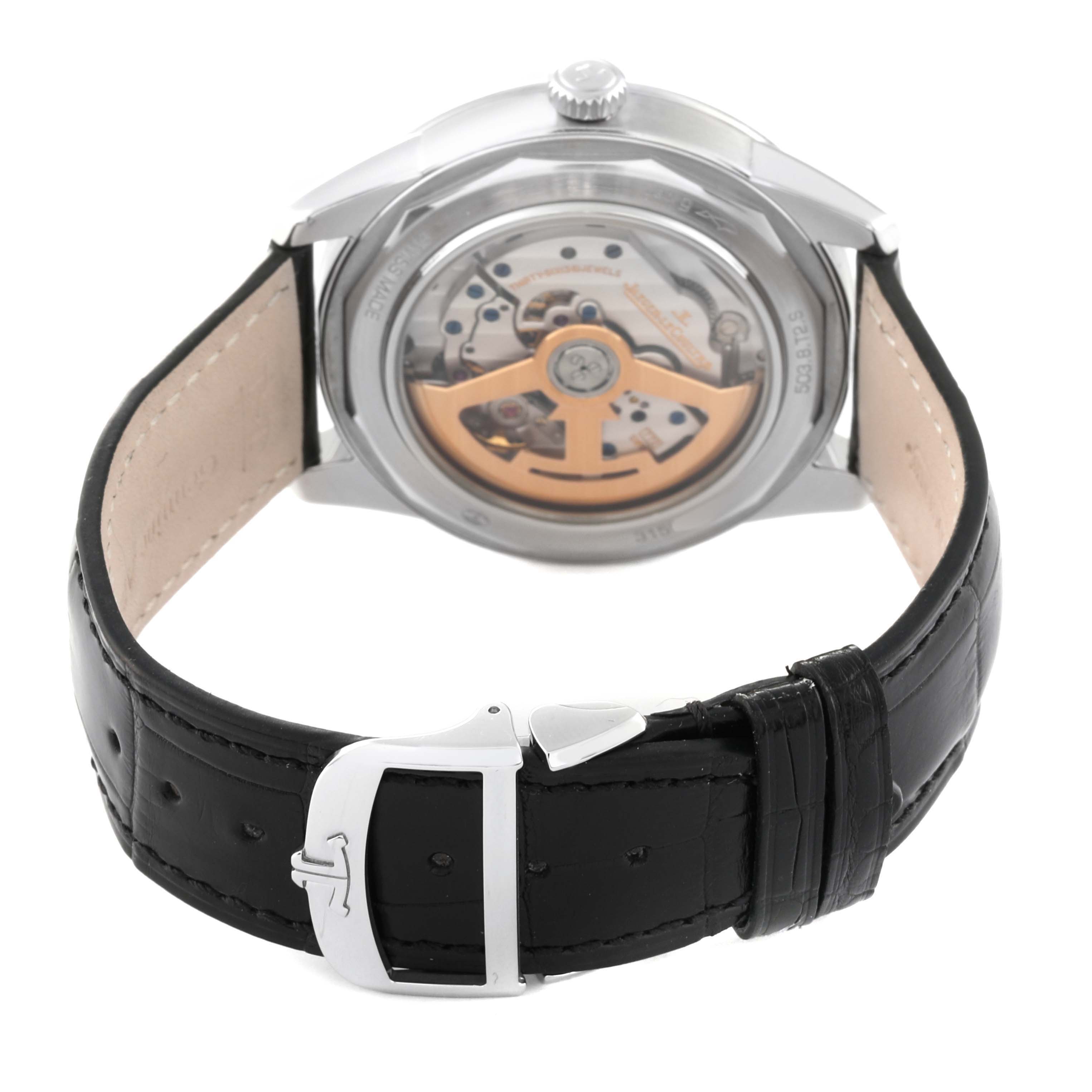 The image shows the back view of the Geophysic model by Jaeger LeCoultre, highlighting the automatic movement and black leather strap.