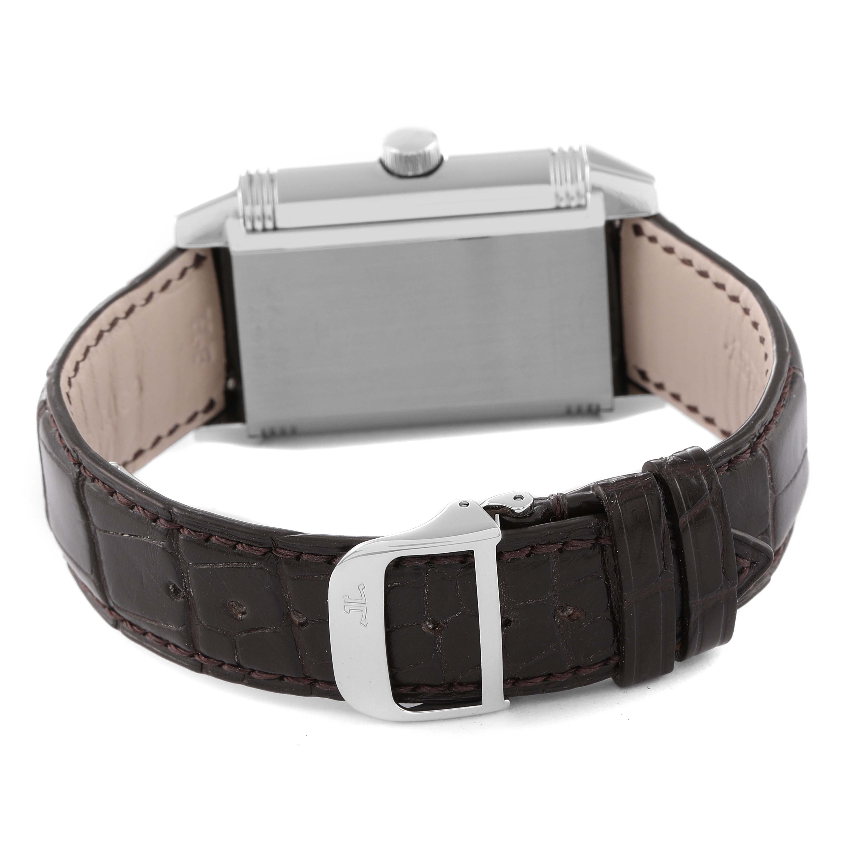 The image shows the back and side profile of a Jaeger LeCoultre Reverso Q3008420 Men's Stainless Steel Silver Dial Q3008420 Men's Stainless Steel Silver Dial watch, highlighting the case, crown, and leather strap with buckle.