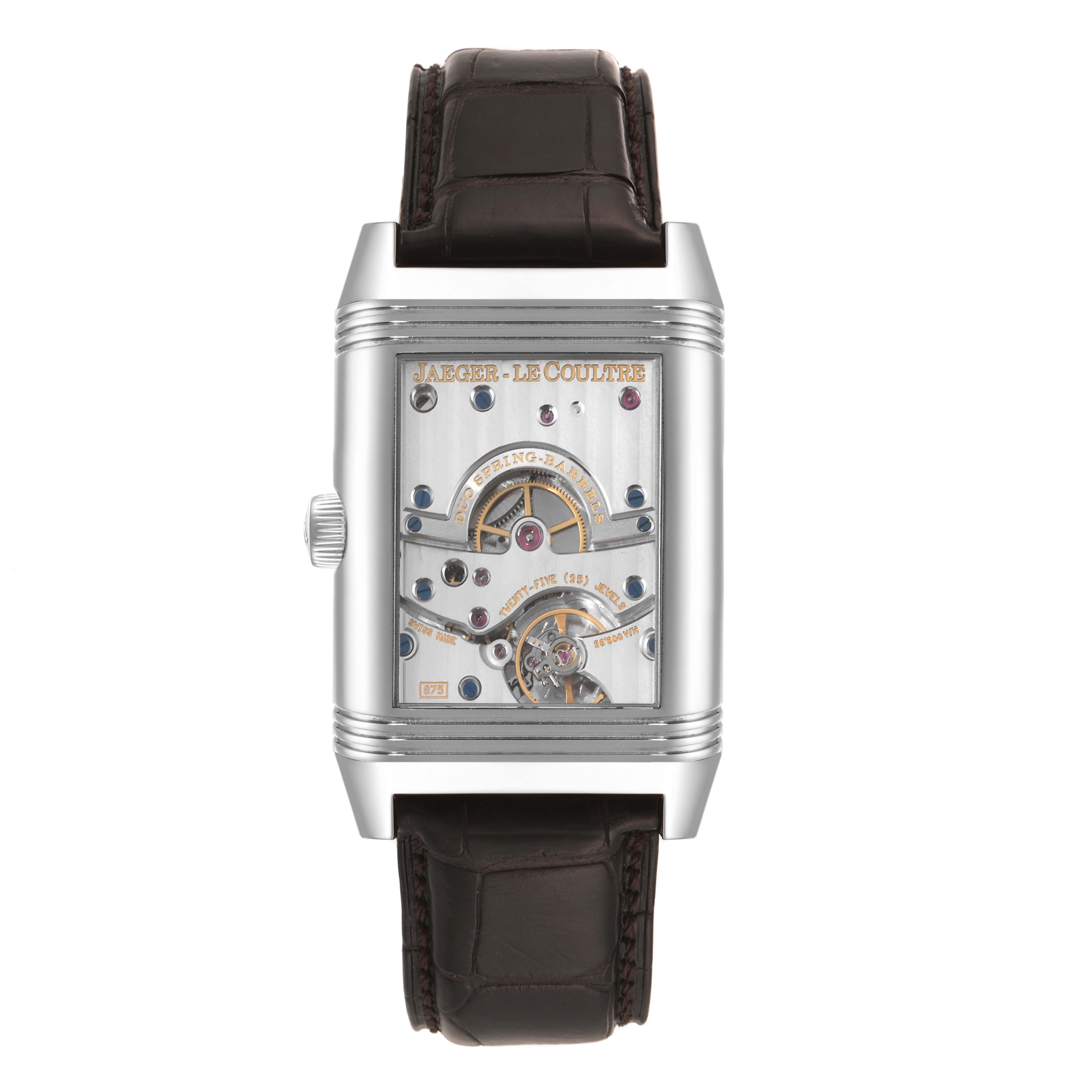 The image shows a front view of a Jaeger LeCoultre Reverso Q3008420 Men's Stainless Steel Silver Dial Q3008420 Men's Stainless Steel Silver Dial watch with an exposed mechanism and brown leather strap.