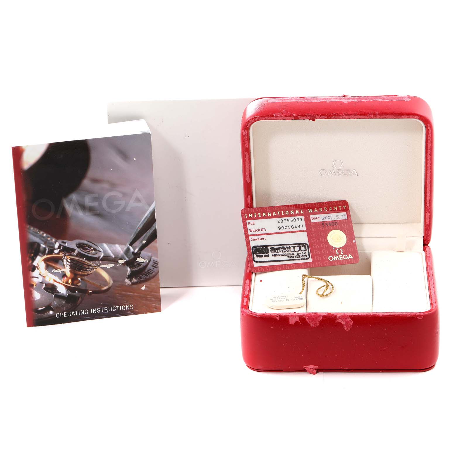 The image shows the accessories for an Omega Seamaster 2895.30.91 Men's Stainless Steel Silver Dial 2895.30.91 Men's Stainless Steel Silver Dial watch, including an instruction manual, warranty card, and the watch box.