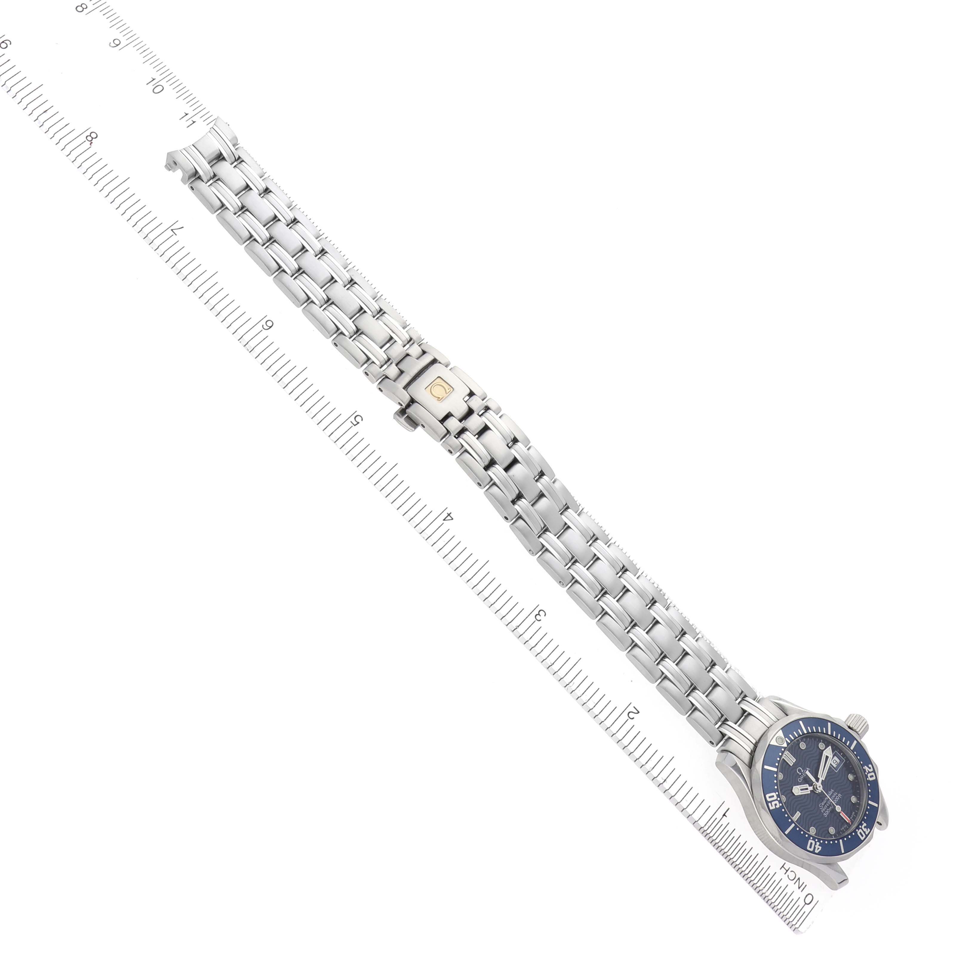 The Omega 2583.80.00 Women's Stainless Steel Blue Dial 2583.80.00 Women's Stainless Steel Blue Dial Seamaster Diver 300M 28mm is shown from an angled top view, displaying the face, bezel, and full bracelet.