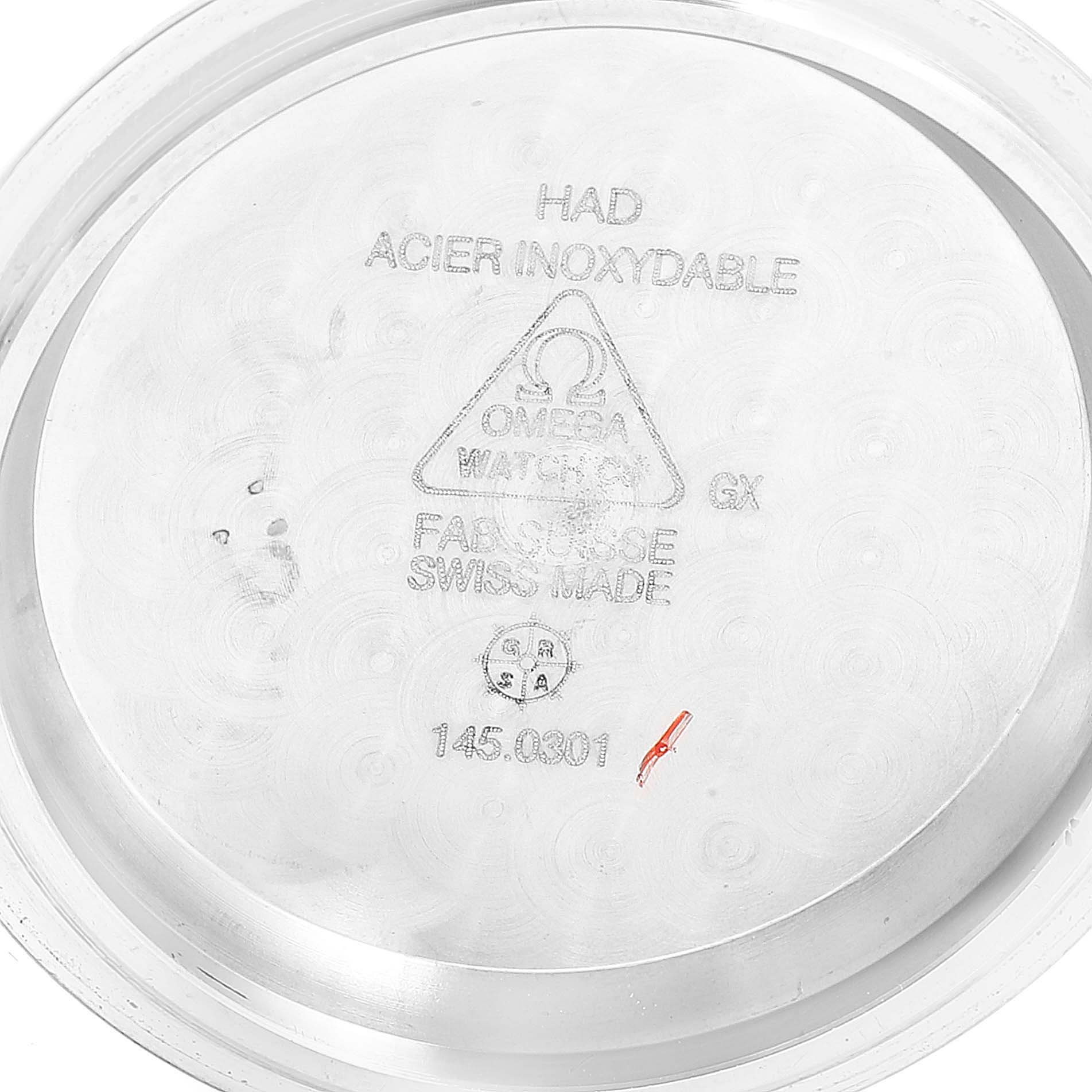 This image shows the inside of the case back for an Omega Speedmaster 311.30.42.30.01.001 Men's Stainless Steel Black Dial 311.30.42.30.01.001 Men's Stainless Steel Black Dial watch, displaying its inscriptions and model number.