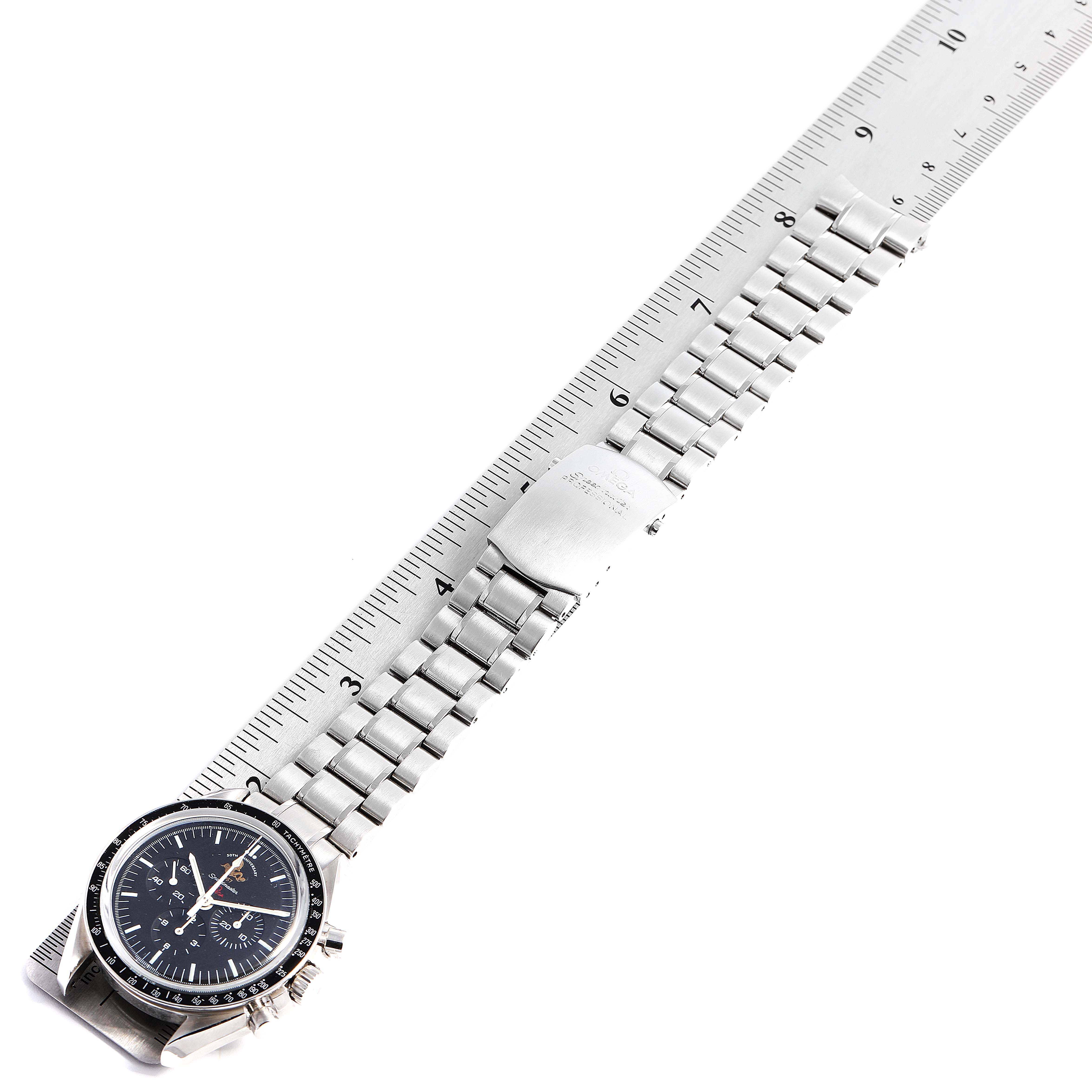 The image shows an Omega Speedmaster 311.30.42.30.01.001 Men's Stainless Steel Black Dial 311.30.42.30.01.001 Men's Stainless Steel Black Dial watch laid flat next to a ruler, displaying the face, bracelet, and clasp.