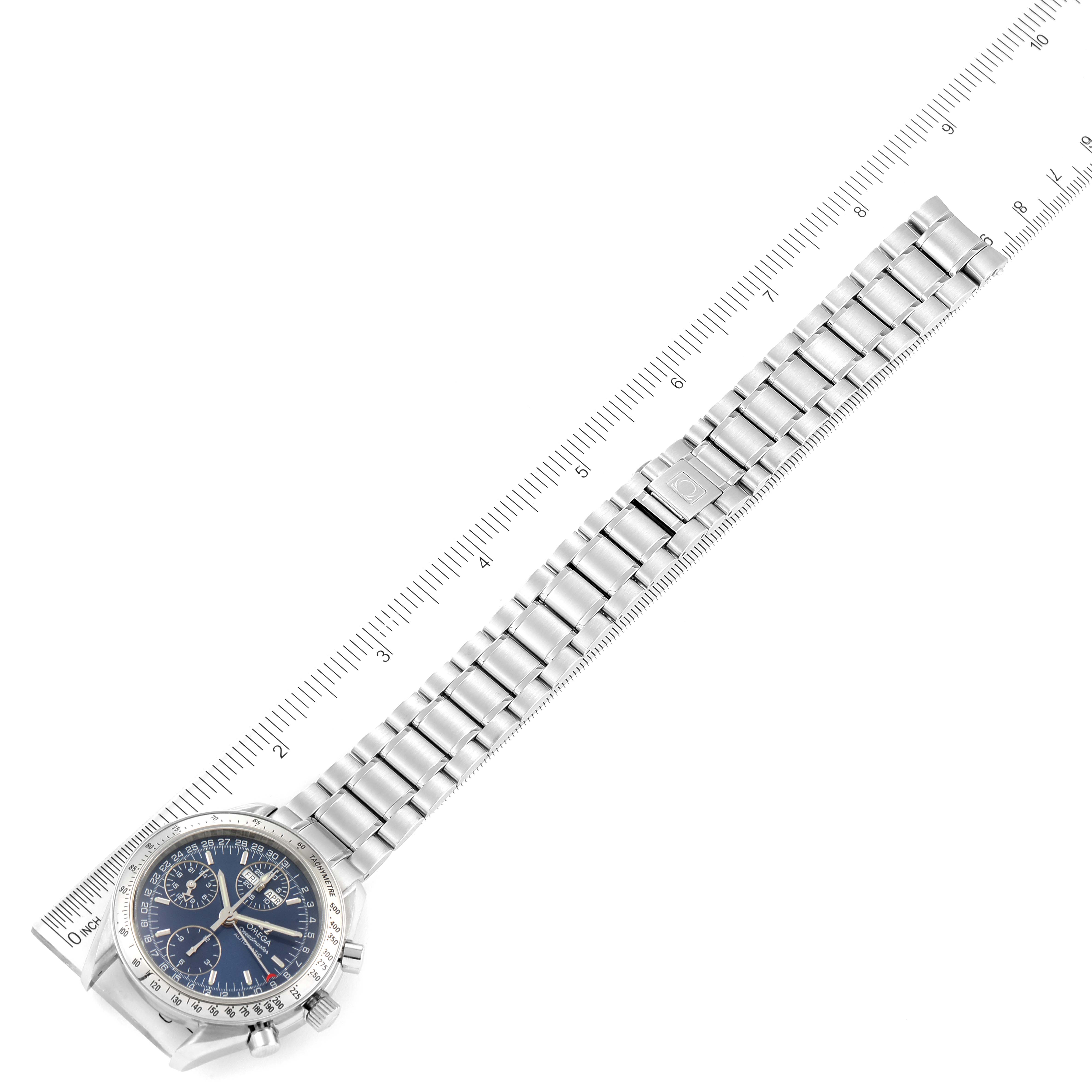 The Omega Speedmaster 3523.80.00 Men
s Stainless Steel Blue Dial 3523.80.00 Men
s Stainless Steel Blue Dial watch is shown from a top-down angle with a ruler measuring the length of its metal bracelet.