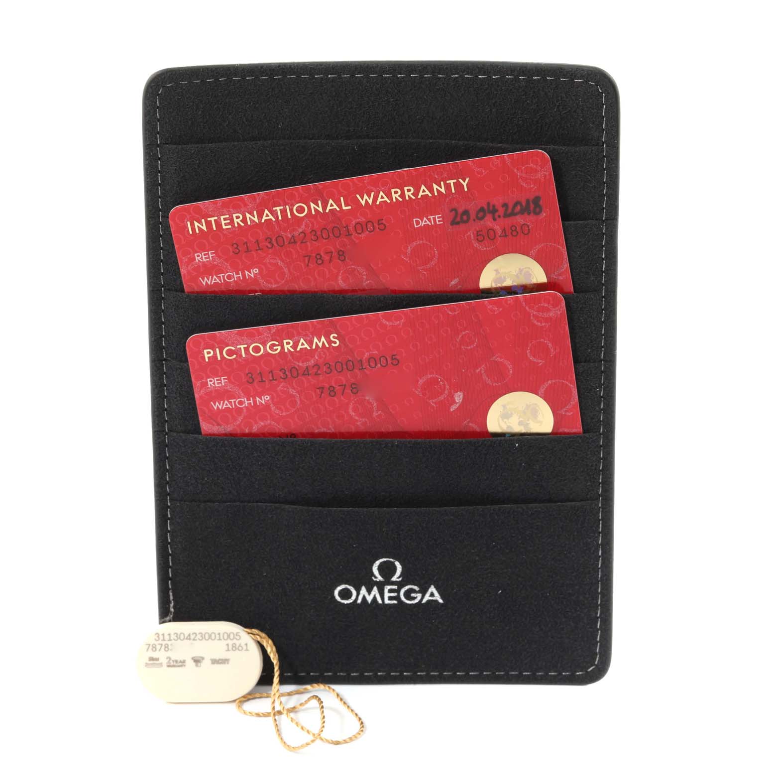 The image shows warranty cards and a tag for an Omega Speedmaster 311.30.42.30.01.005 Men
s Stainless Steel Black Dial 311.30.42.30.01.005 Men
s Stainless Steel Black Dial, placed in a black Omega cardholder.