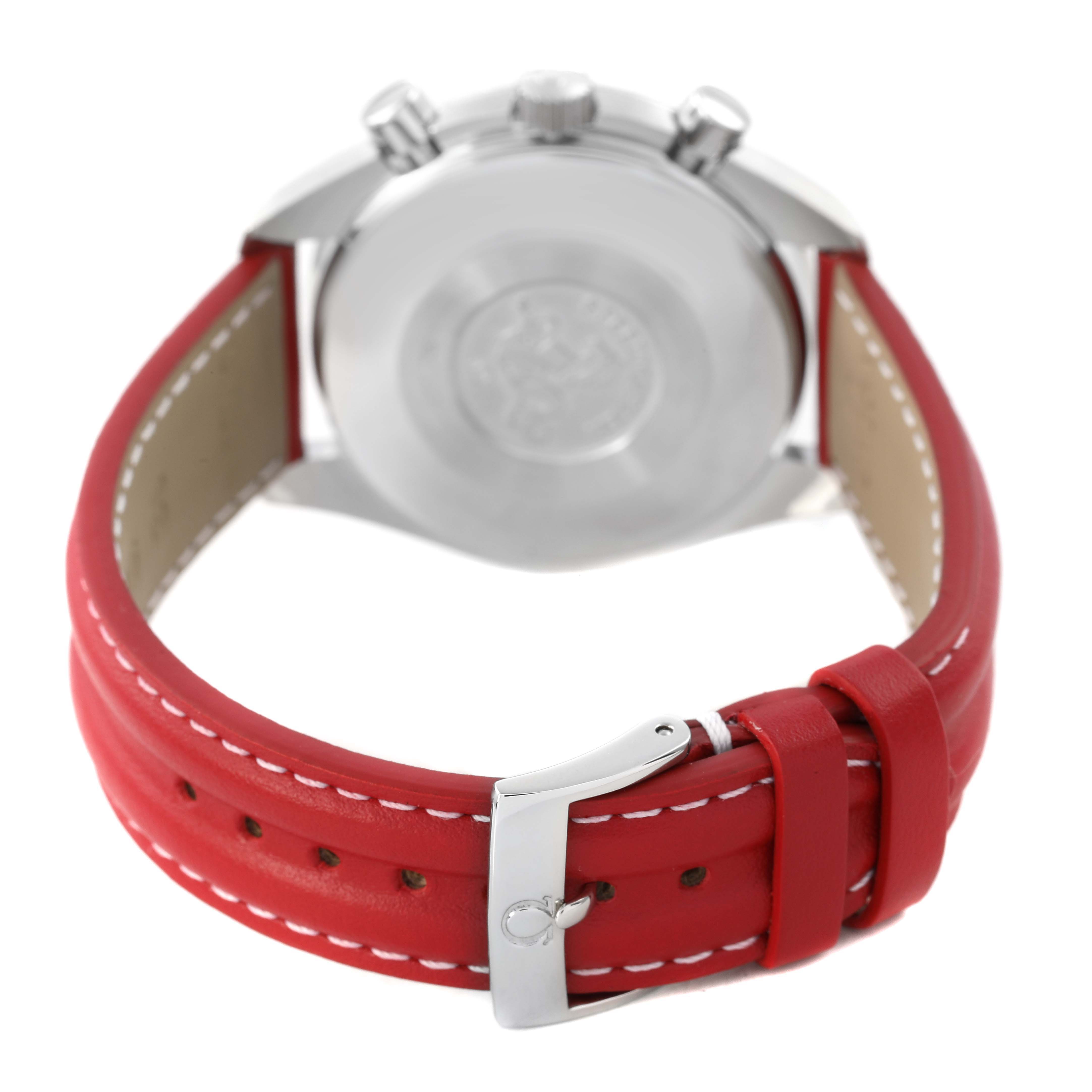 The Omega Speedmaster 3810.61.41 Men's Stainless Steel Red Dial watch is shown from the back, highlighting the case back and red leather strap with buckle.