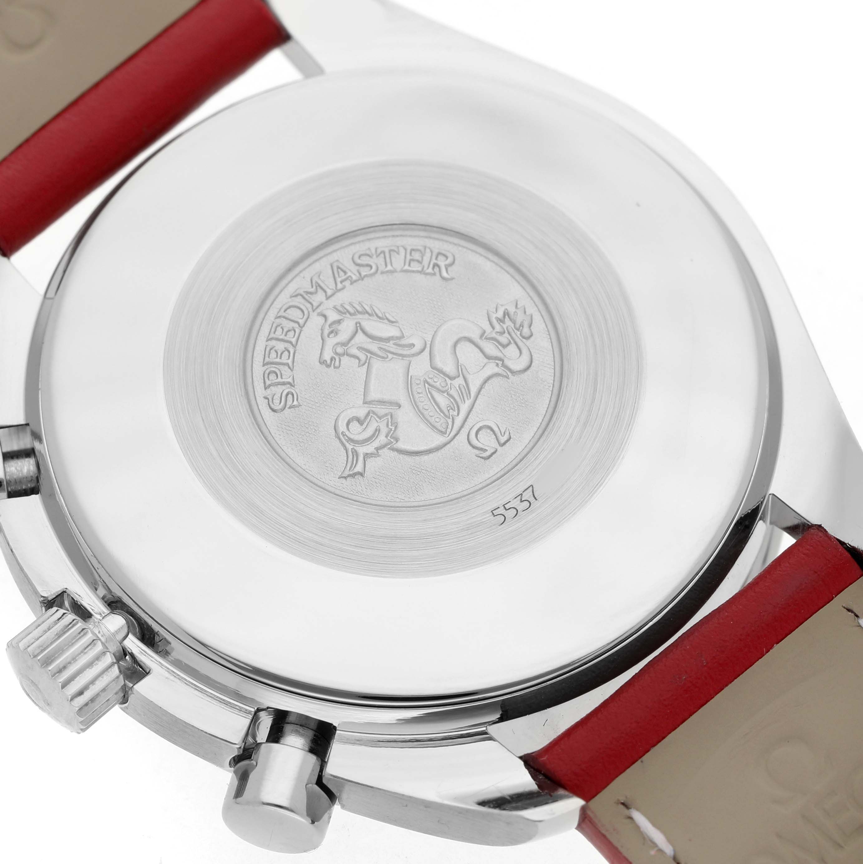 This Omega Speedmaster 3810.61.41 Men's Stainless Steel Red Dial watch is shown from the back, highlighting the case back, engraved logo, and part of the strap.
