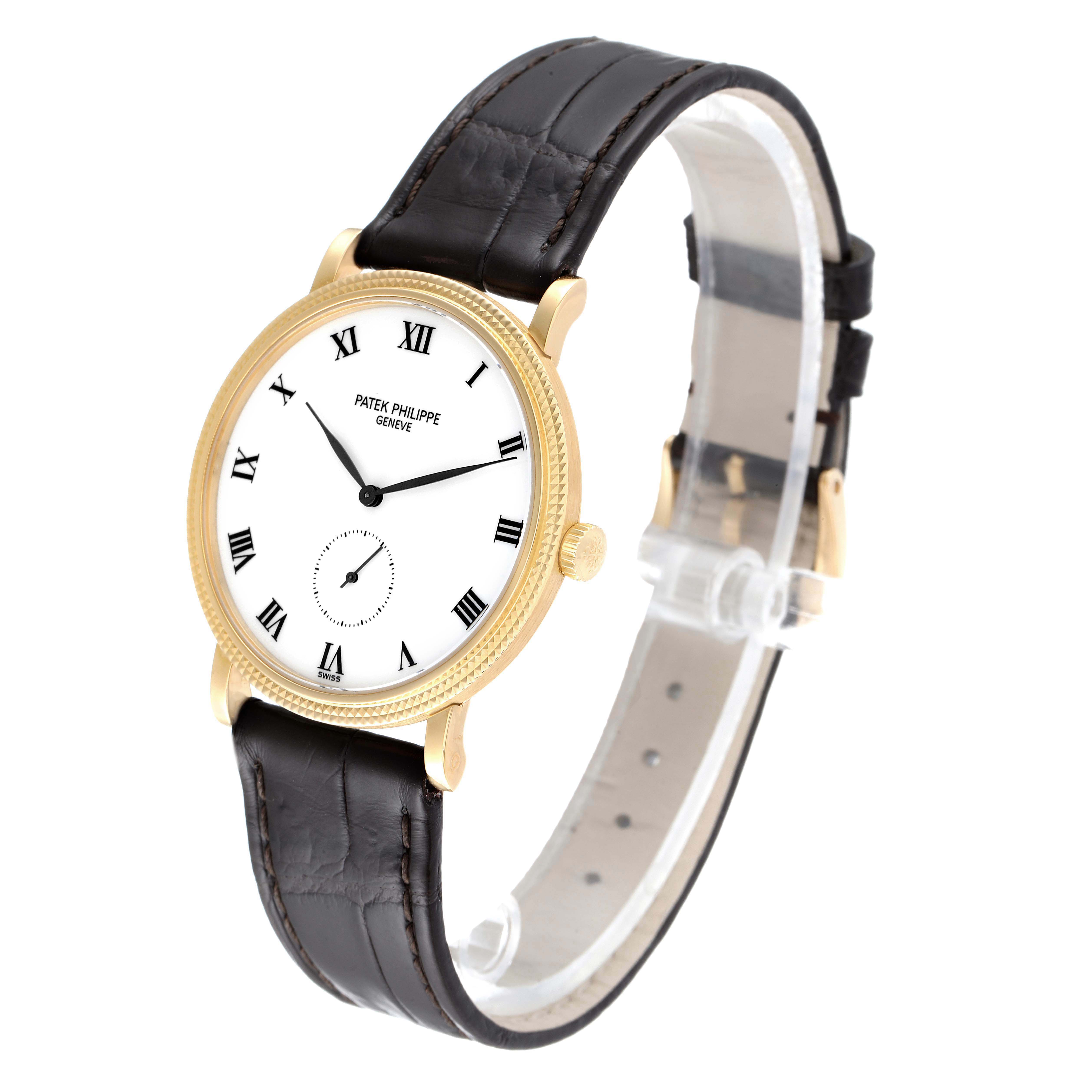 The image shows a Patek Philippe Calatrava 3919J Men's Yellow Gold White Dial 3919J Men's Yellow Gold White Dial watch from a side angle, highlighting its dial, case, and leather strap.