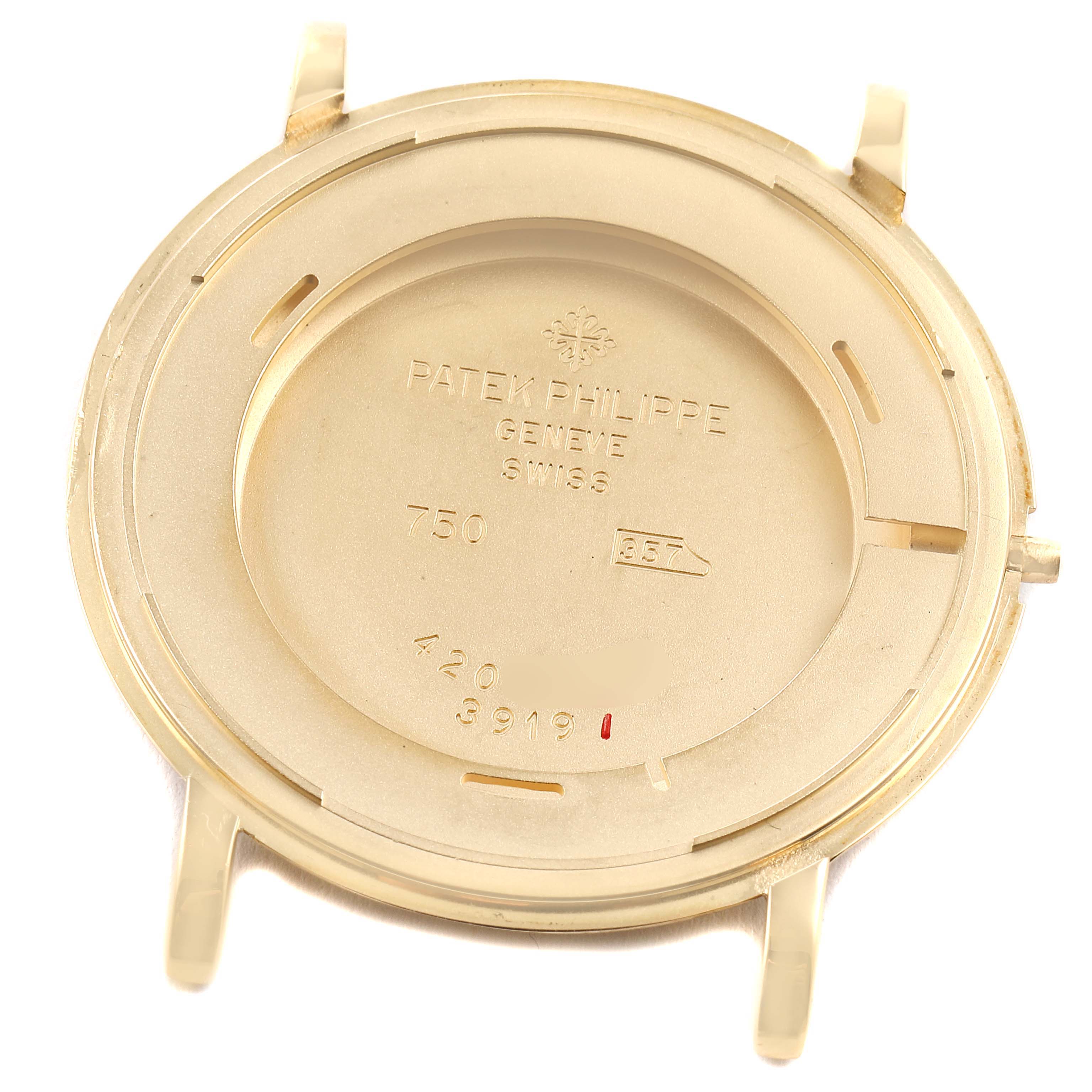 This image shows the inner case back of a Patek Philippe Calatrava 3919J Men's Yellow Gold White Dial 3919J Men's Yellow Gold White Dial watch viewed from the back.