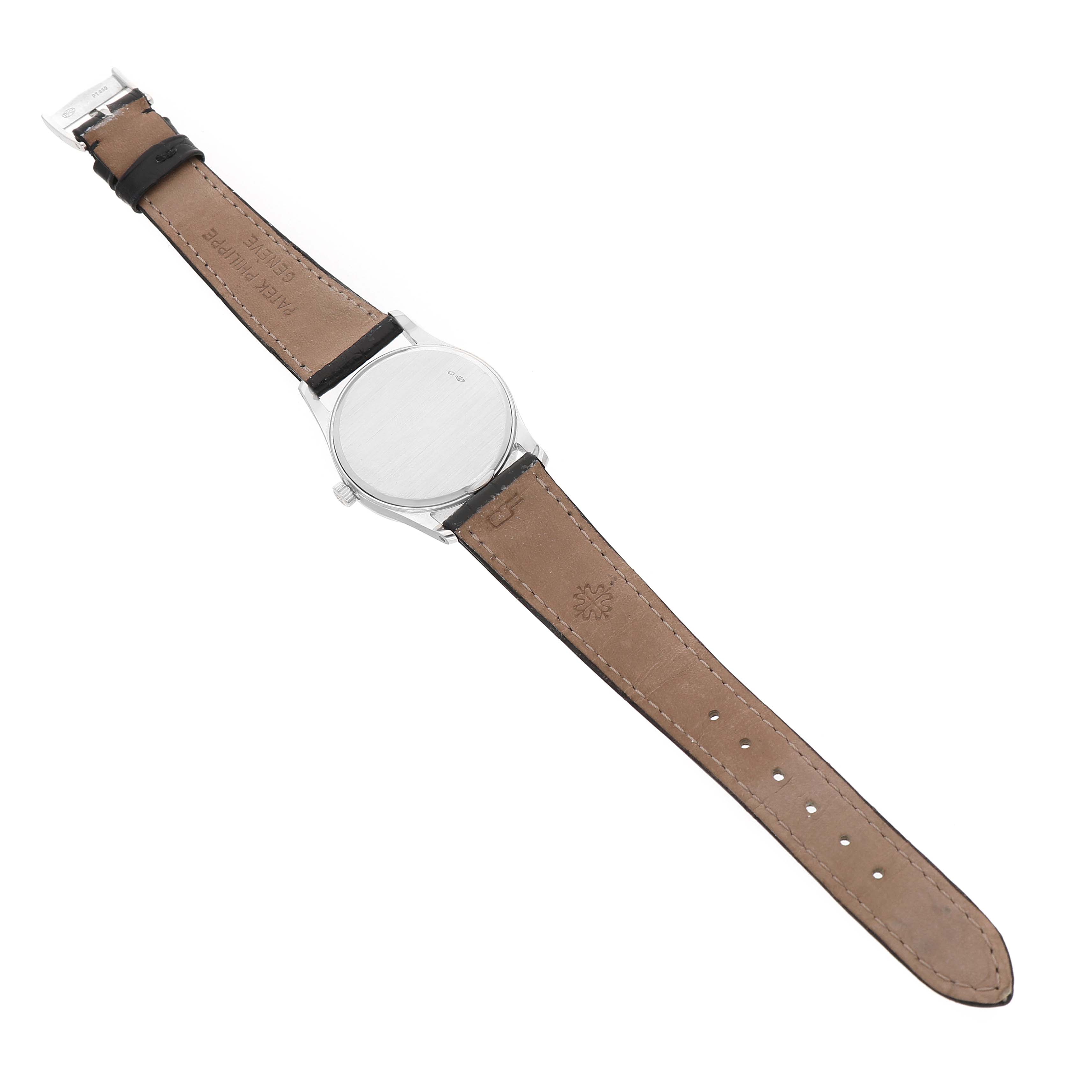 The image shows a Patek Philippe Calatrava 3796P-010 Men's Platinum Silver Dial watch from the back side, highlighting the case back and leather strap.
