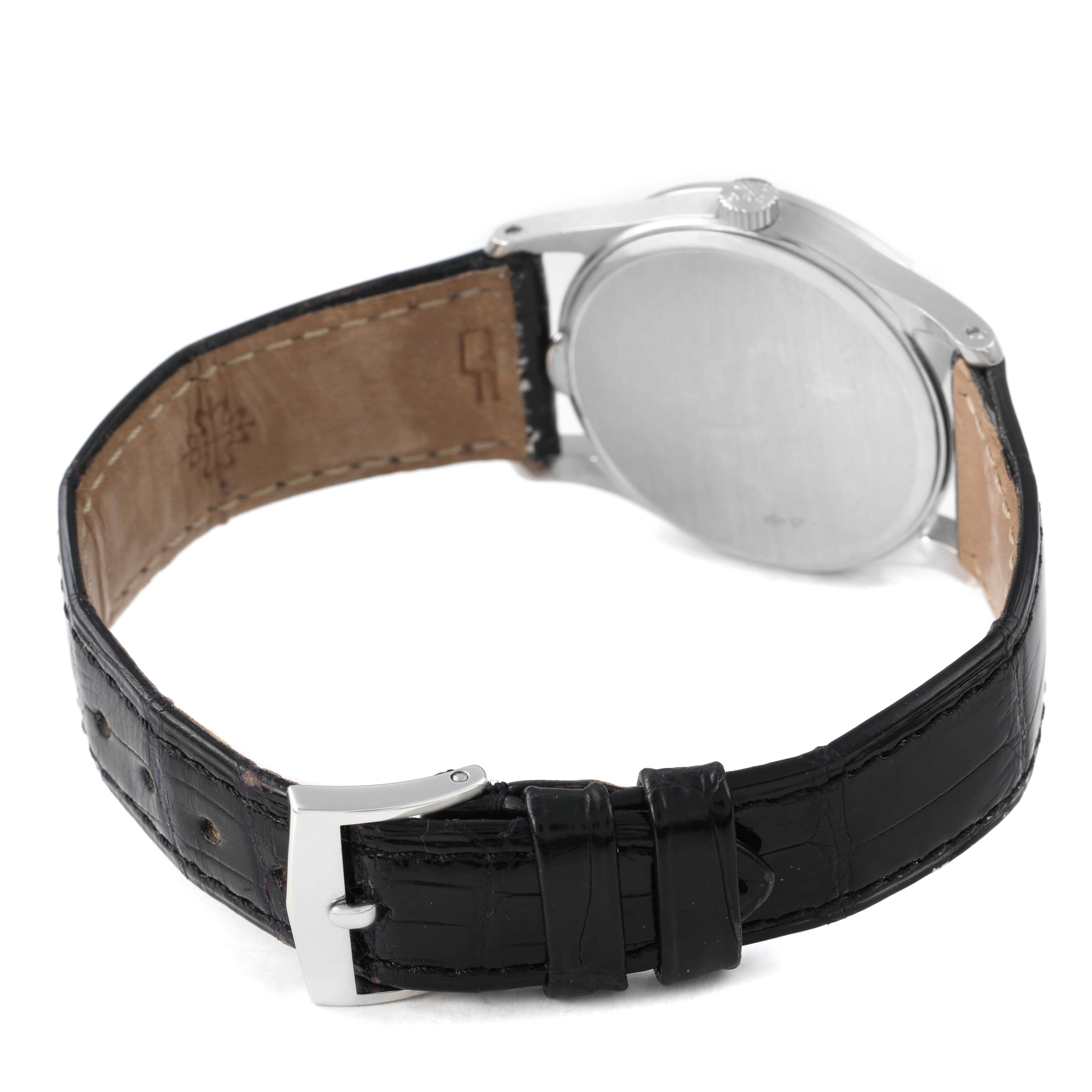 The image shows the Patek Philippe Calatrava 3796P-010 Men's Platinum Silver Dial watch from the back, featuring the case back, strap, and buckle.