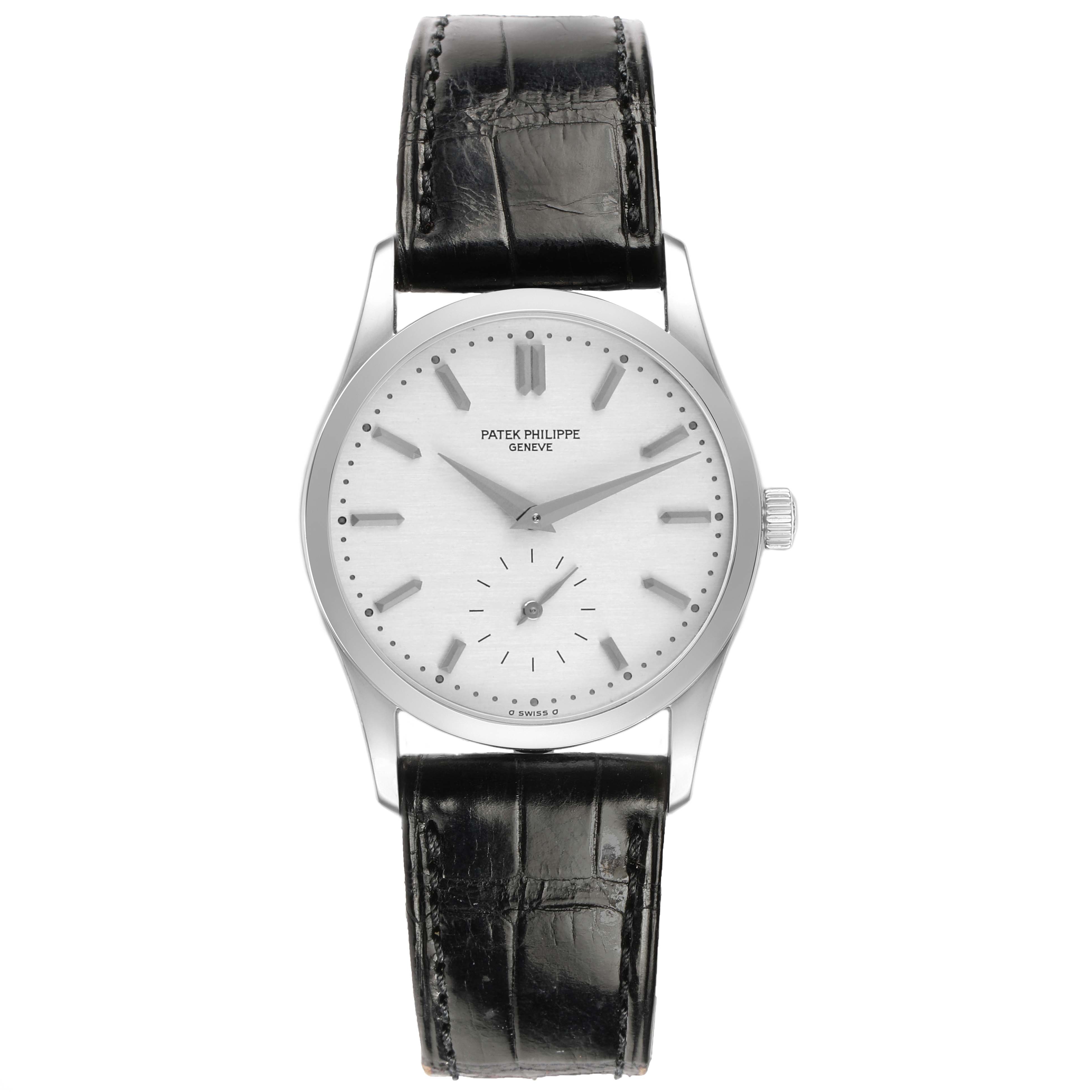 The Patek Philippe Calatrava 3796P-010 Men's Platinum Silver Dial watch is shown from a front angle, displaying its black leather strap and silver dial with minimalistic markers.