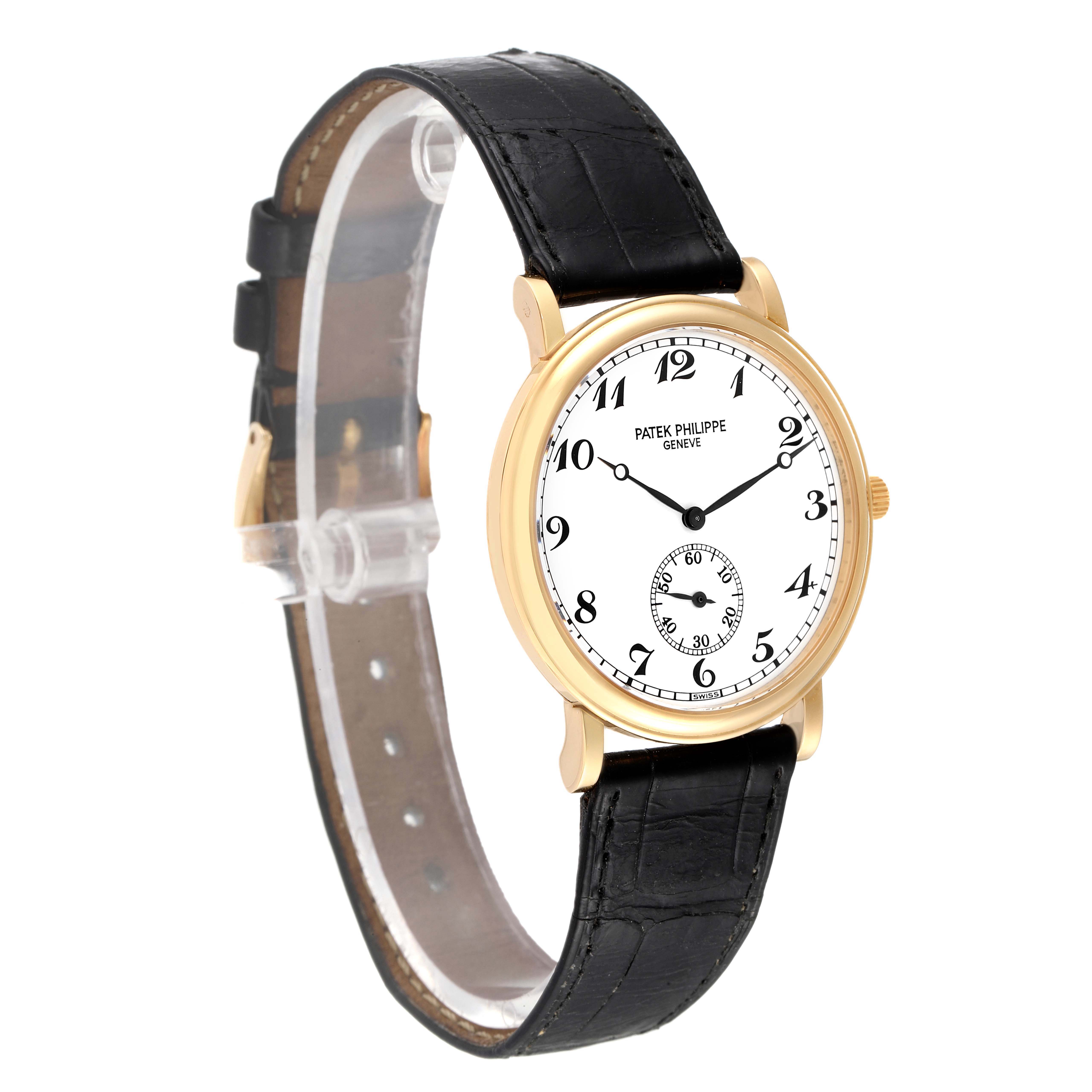 The image shows a side angle of the Patek Philippe Calatrava 5022 Men's Yellow Gold White Dial 5022 Men's Yellow Gold White Dial watch, displaying the watch face, case, and black leather strap.