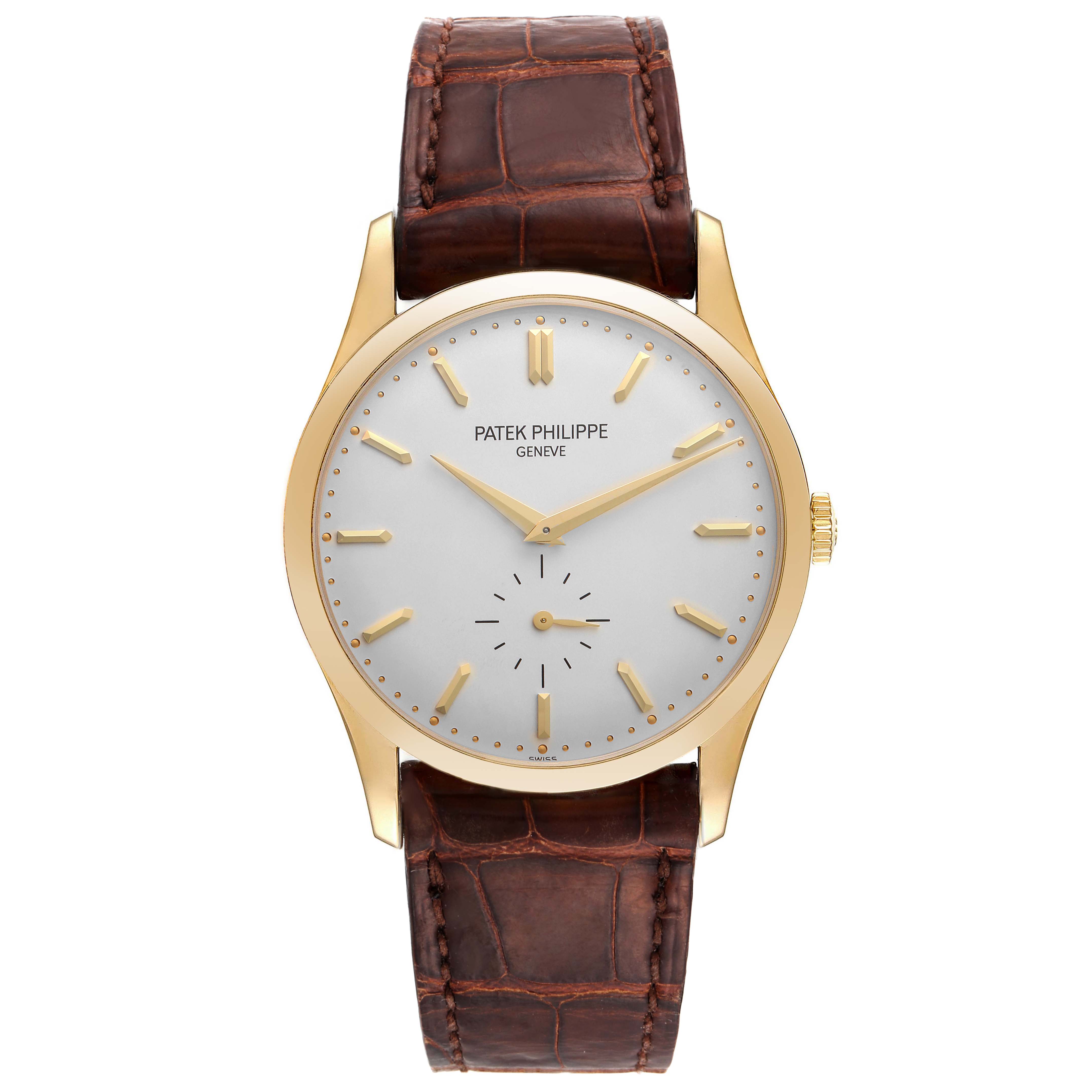 The image shows a front view of the Patek Philippe Calatrava 5196J Men's Yellow Gold Silver Dial 5196J Men's Yellow Gold Silver Dial watch, displaying the face, hour markers, hands, and brown leather strap.